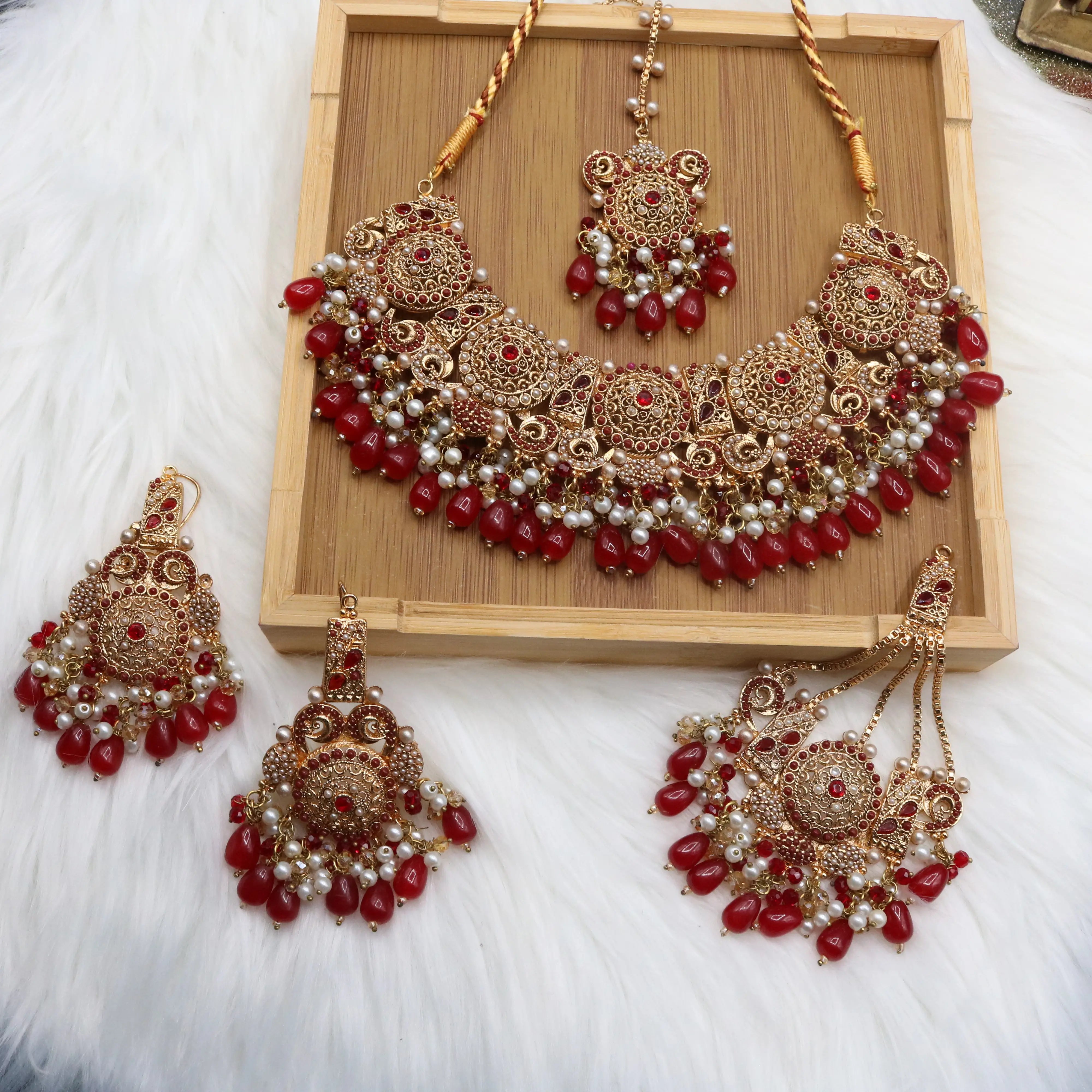 Pakistani bridal necklace set with earrings, jhoomer and teeka in red and gold