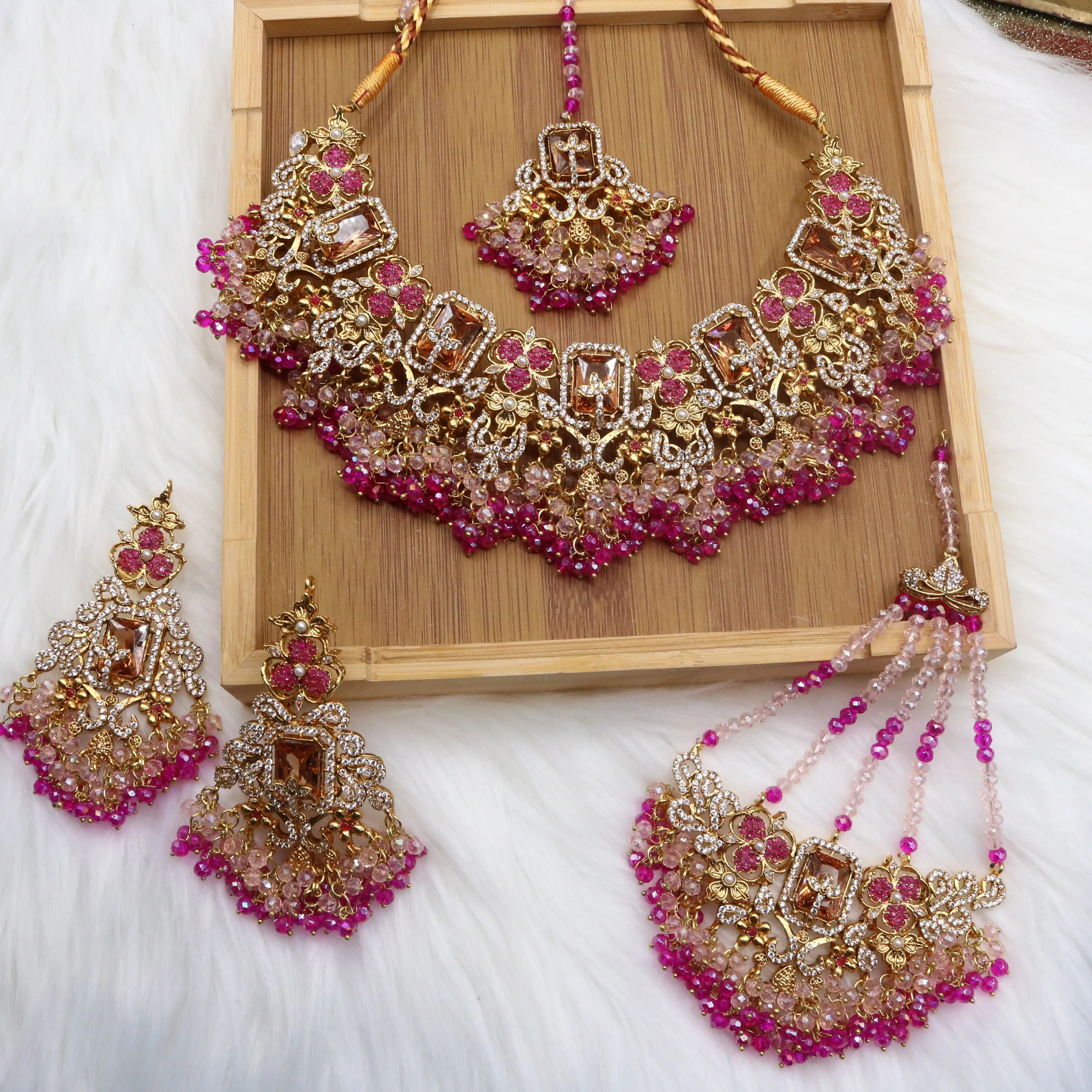 Hot pink and champagne bridal jewelry set with necklace, earrings, teeka & jhoomer