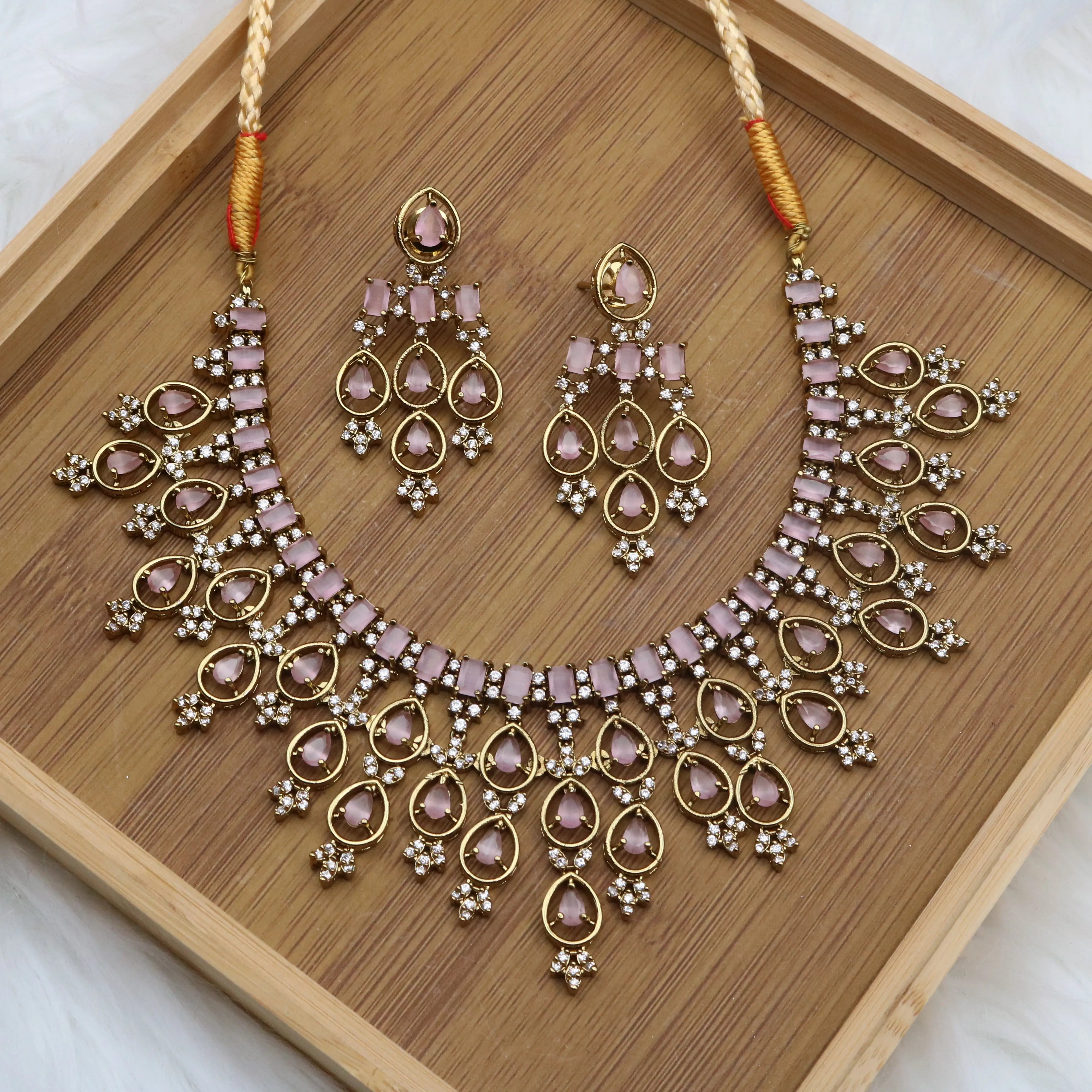 Gold-plated pink stone necklace with matching earrings