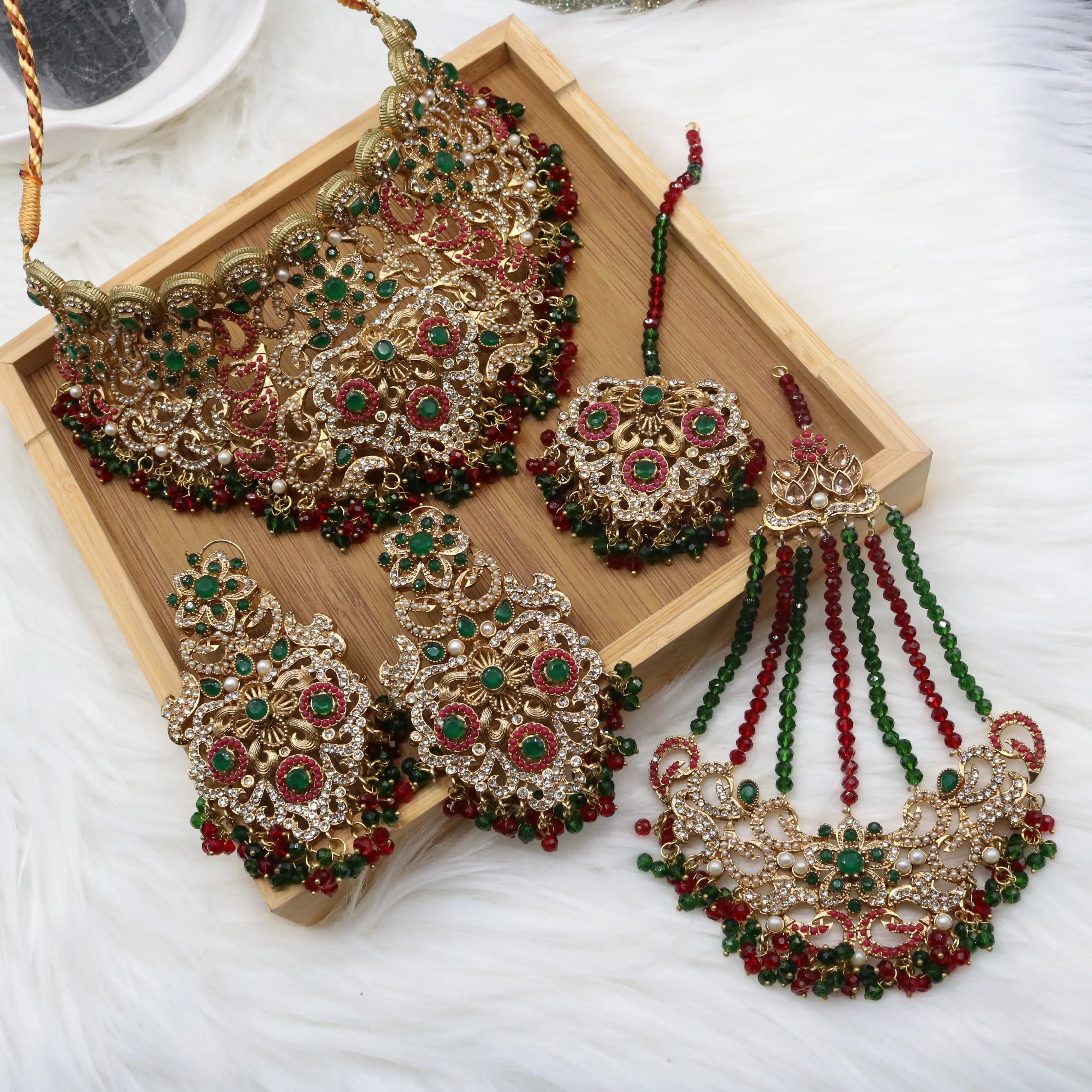 Green and red bridal choker set with necklace, earrings, teeka & jhoomer