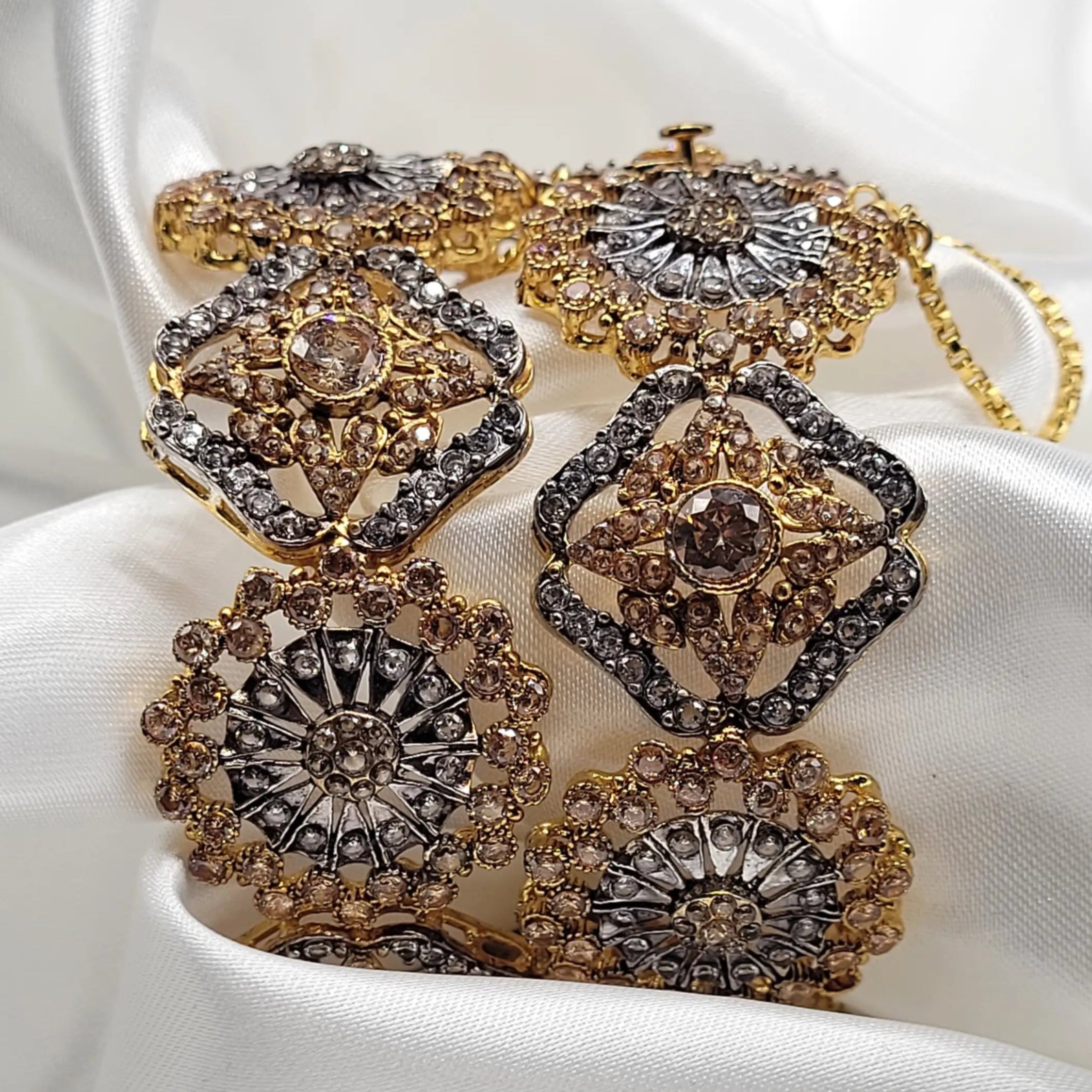 JV3020 antique gold bangles with champagne and grey stones – front view