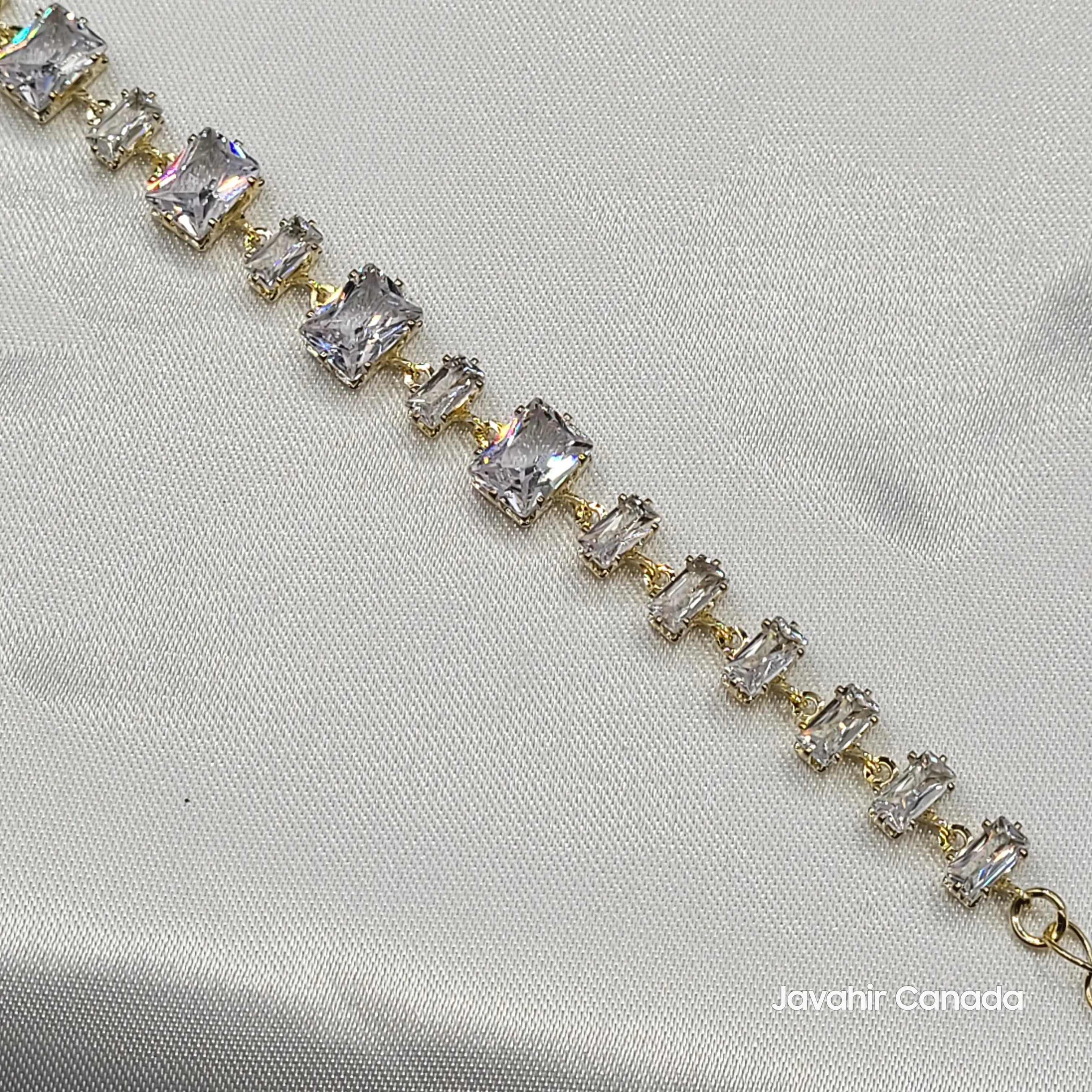 Close-up of JV4007 bracelet with clear emerald-cut CZ stones set in gold-tone finish