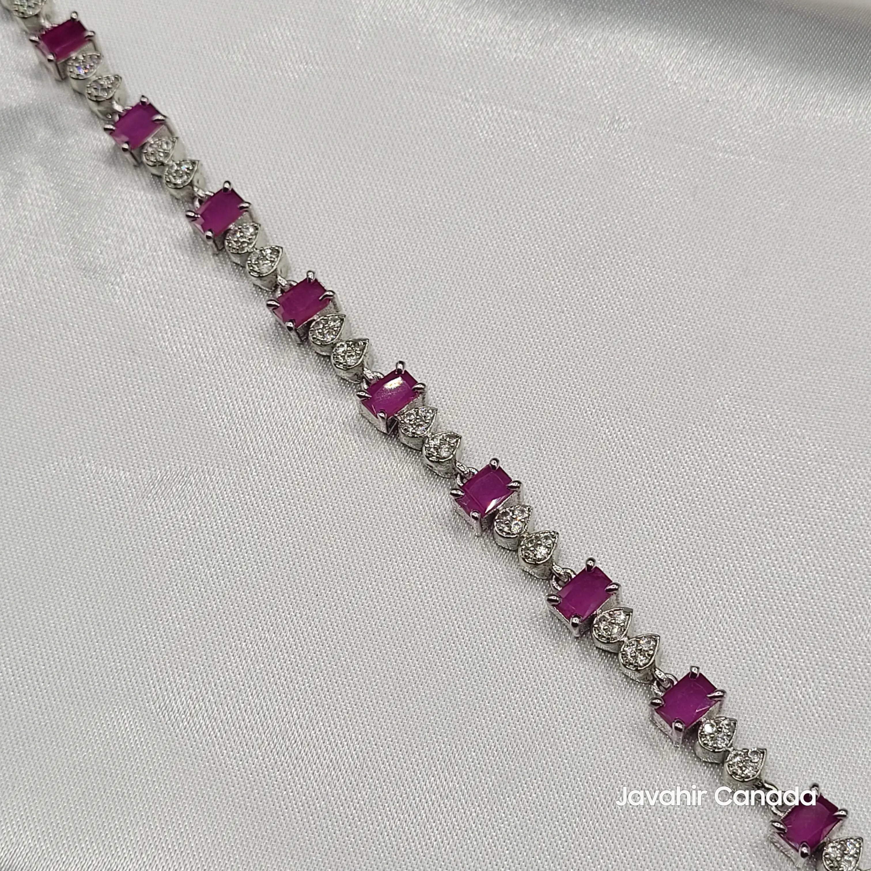 Close-up of JV4016 bracelet showcasing pink CZ stones and teardrop-shaped American diamond accents