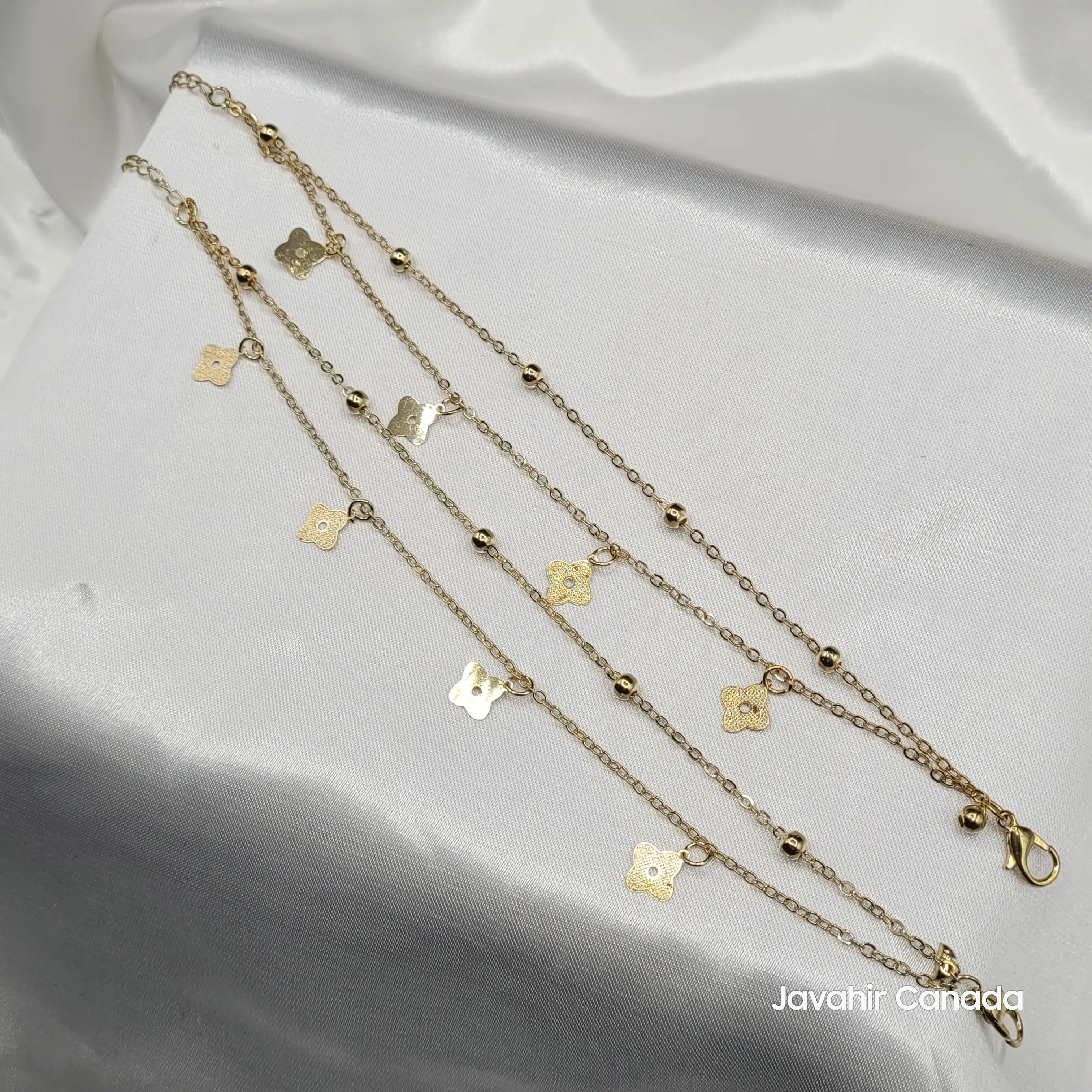 JV5017 gold floral charm anklet pair with delicate chain and textured flower motifs