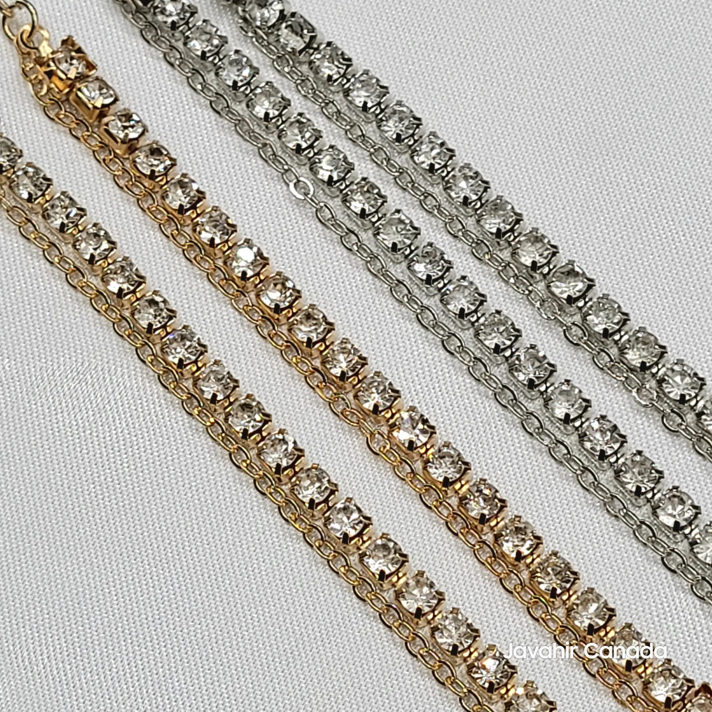 Close-up of JV5022 anklets showing two-row design with sparkling American diamonds in silver and gold finishes