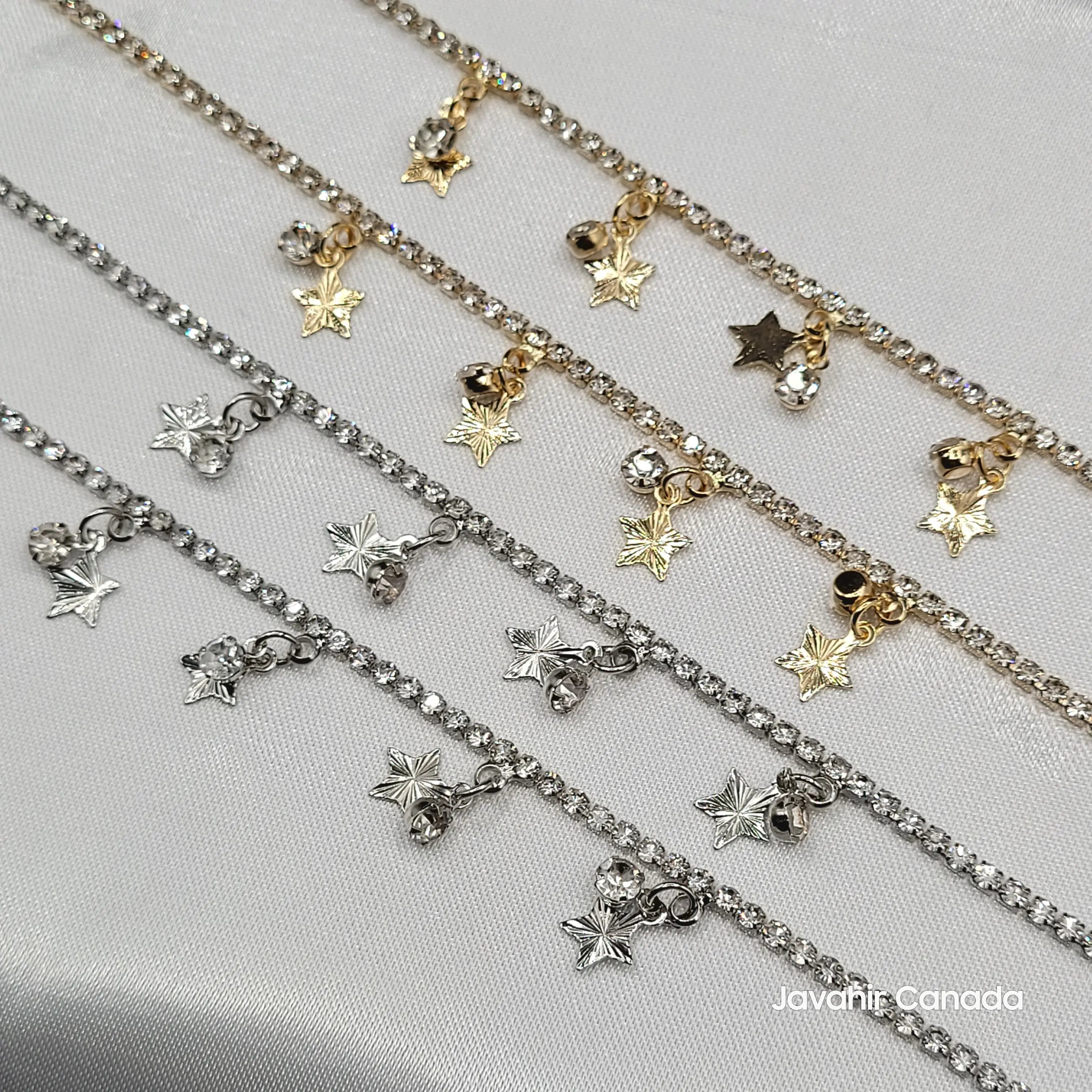 Close-up of JV5023 anklets showing sparkling star-shaped charms, mini ghungroos, and diamond accents in gold and silver variants
