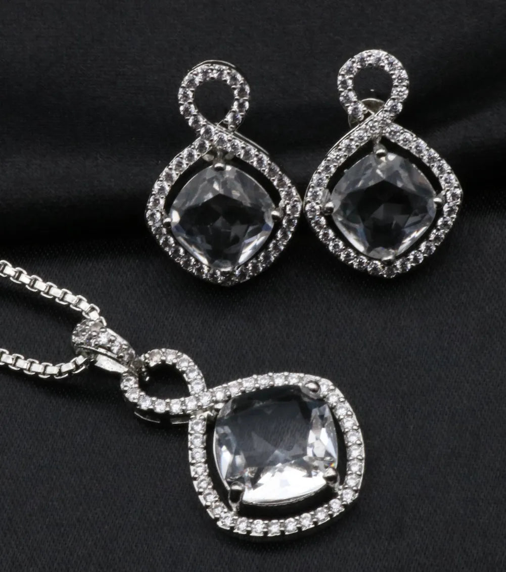 Jewelry pendant set with teardrop-shaped American diamonds on a black background