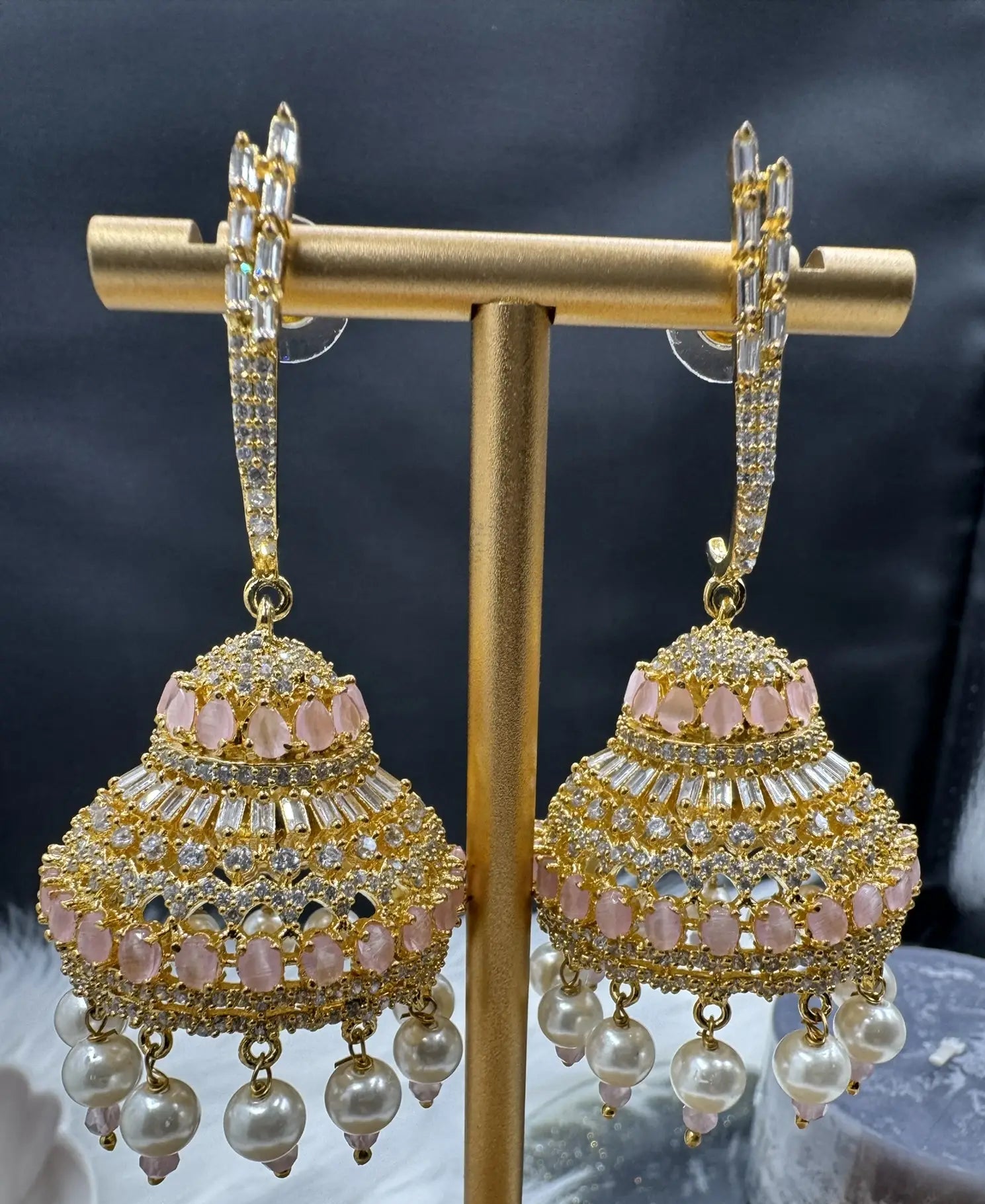 Pakistani design jhumkay with jarao craftsmanship. Pink and clear gemstones providing an exquisite touch.