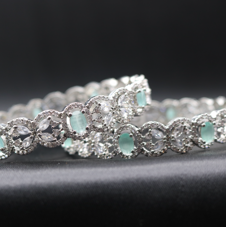 American diamonds stainless steel bangles with teal and clear gemstones