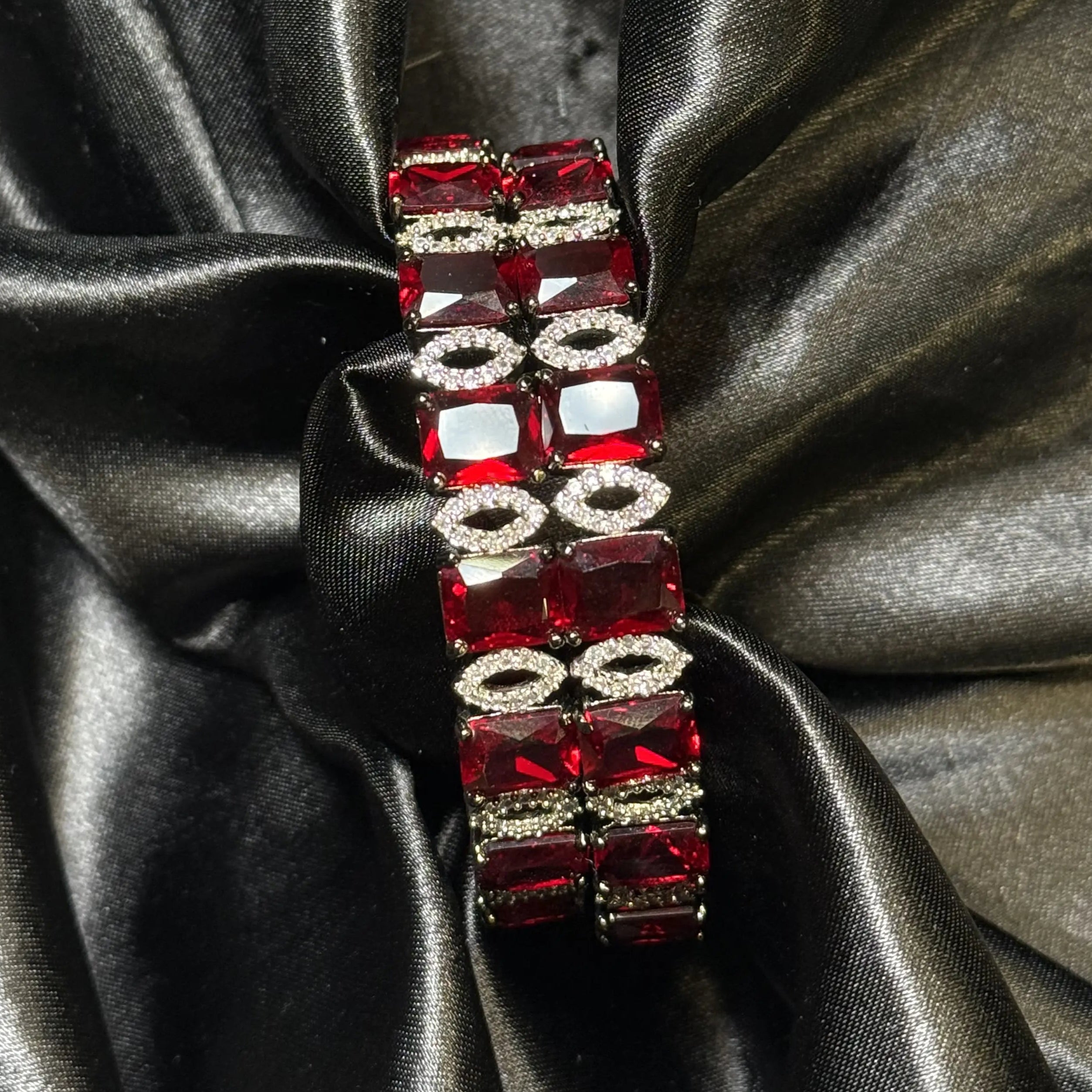 Luxurious party-wear bangle with ruby stones and sparkling accents