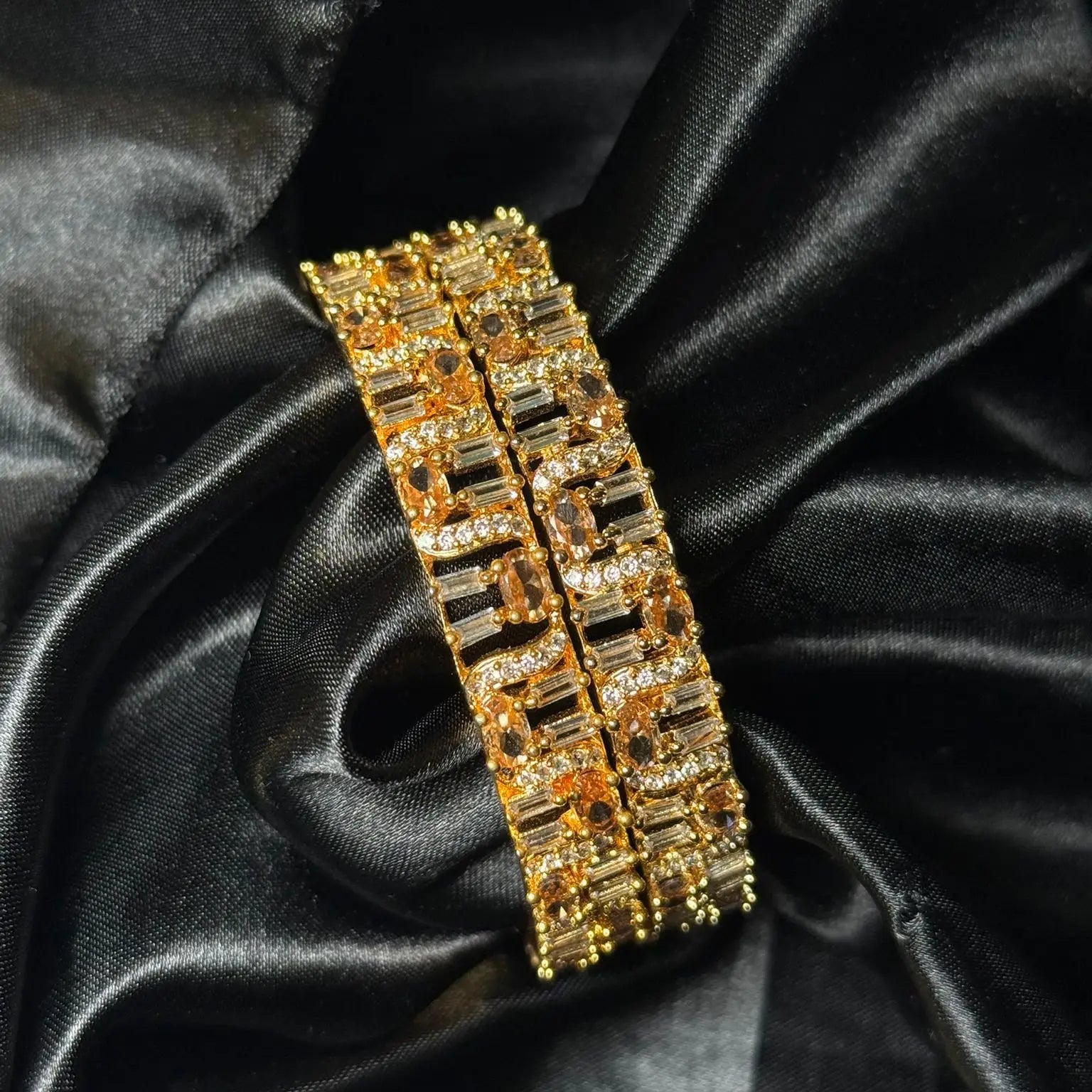 Gold bangle with champagne stones and diamond accents