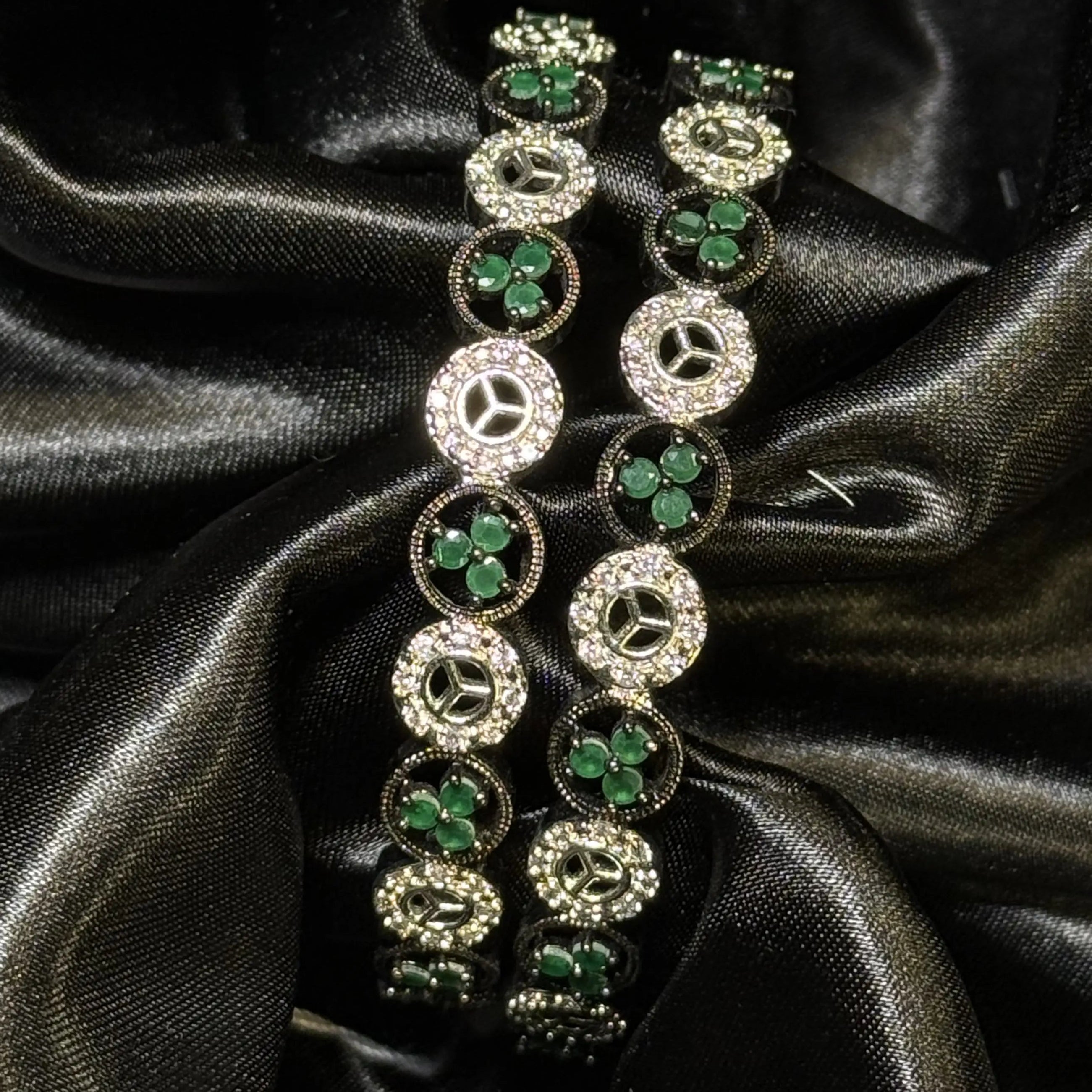 Emerald green floral stone bangles with crystal detailing