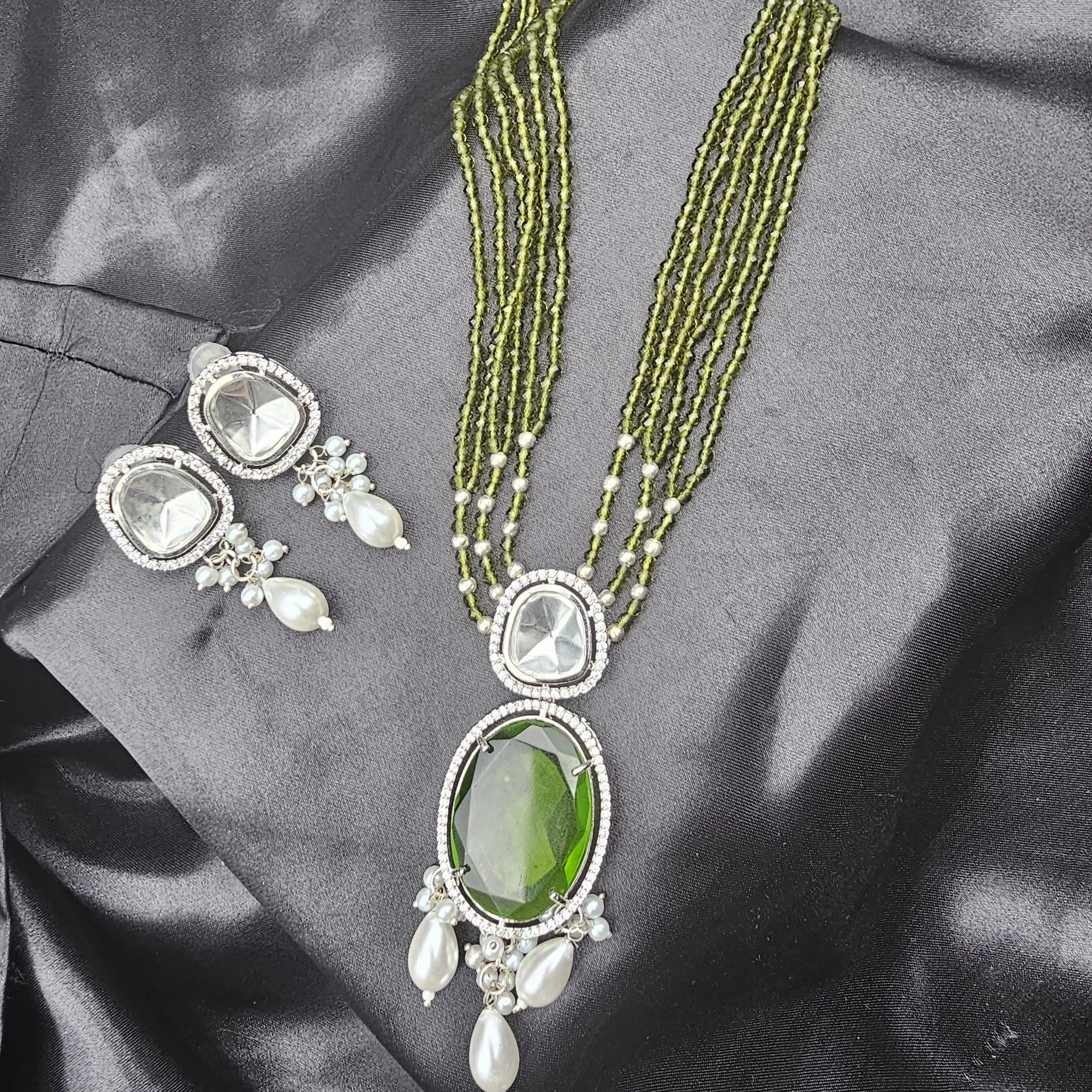 Full view of Caspian necklace set with olive green beaded strands and coordinated earrings.