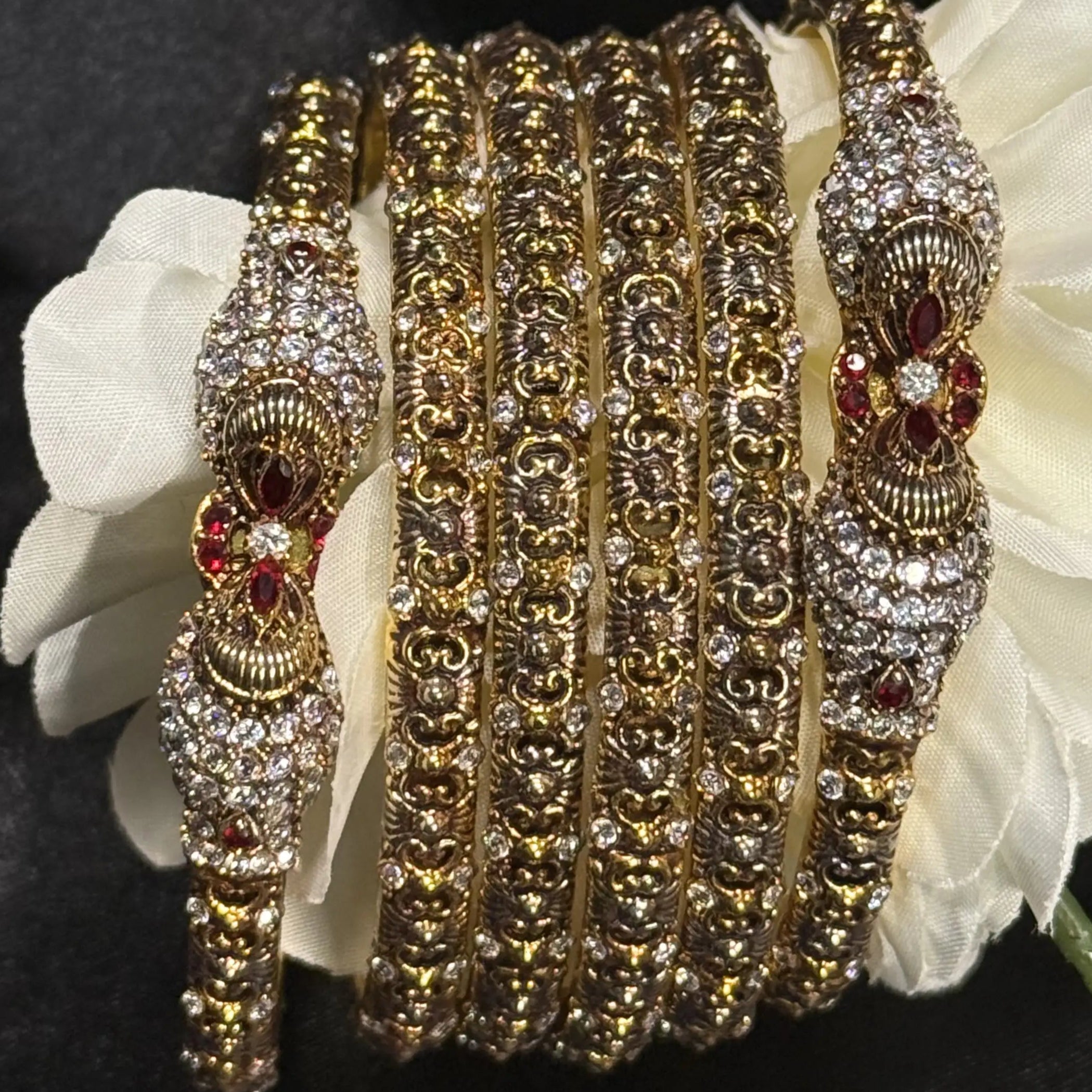 Pakistani solid bangle set with floral red stone motifs
