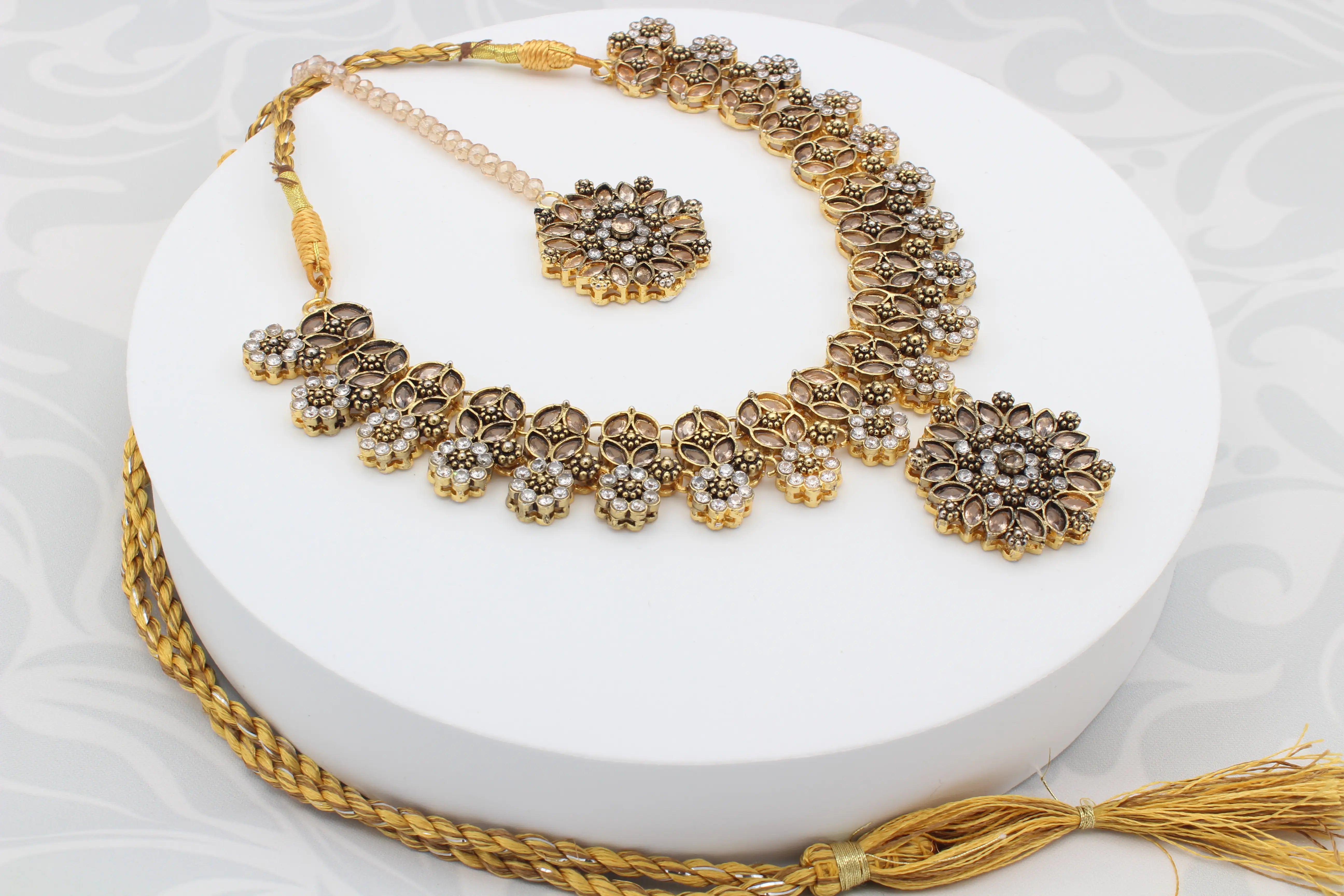 Full view of Ethnic Flower Drop Necklace Set with jhumka earrings and center pendant on display