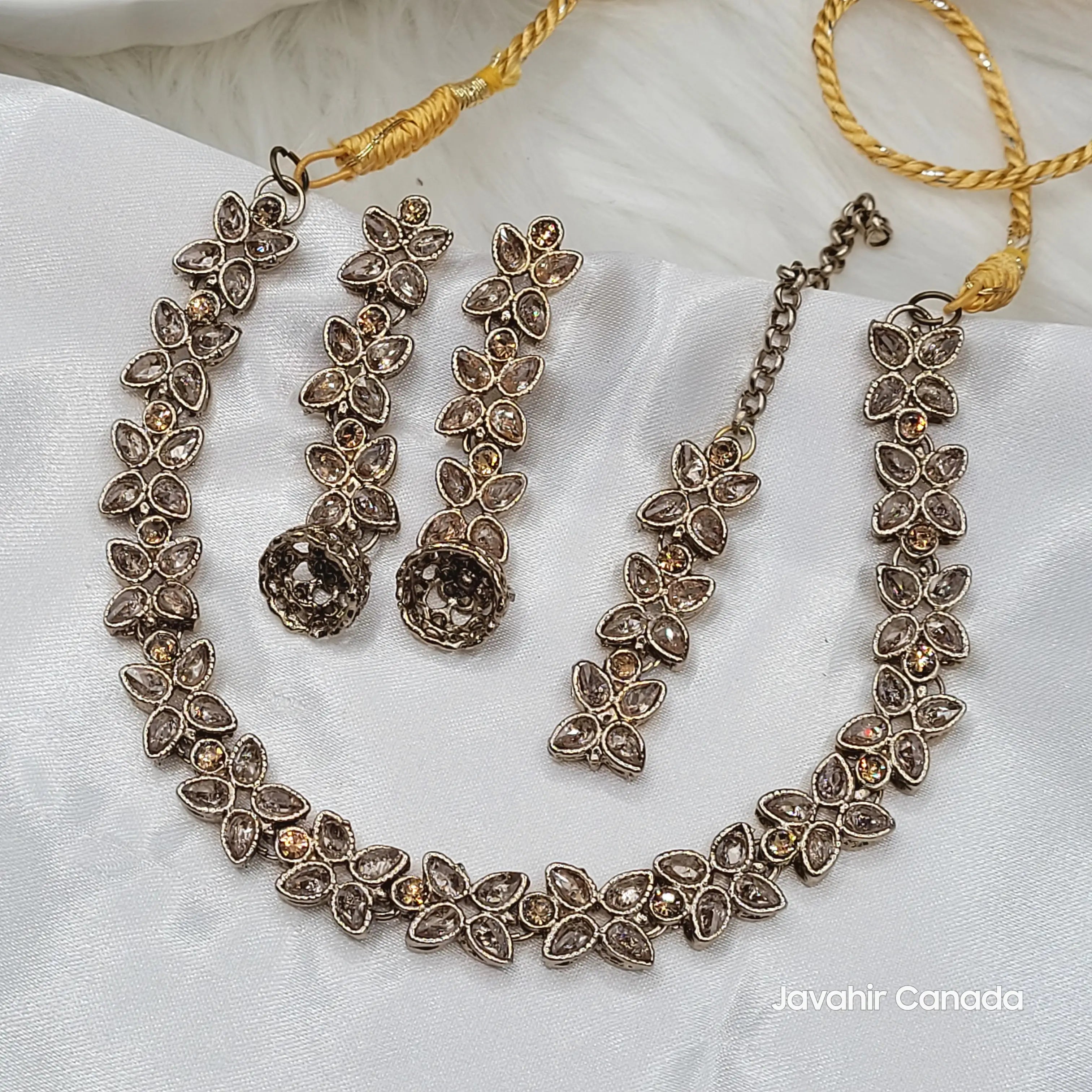 Full view of Flora necklace set in champagne variant showing intricate floral CZ design.