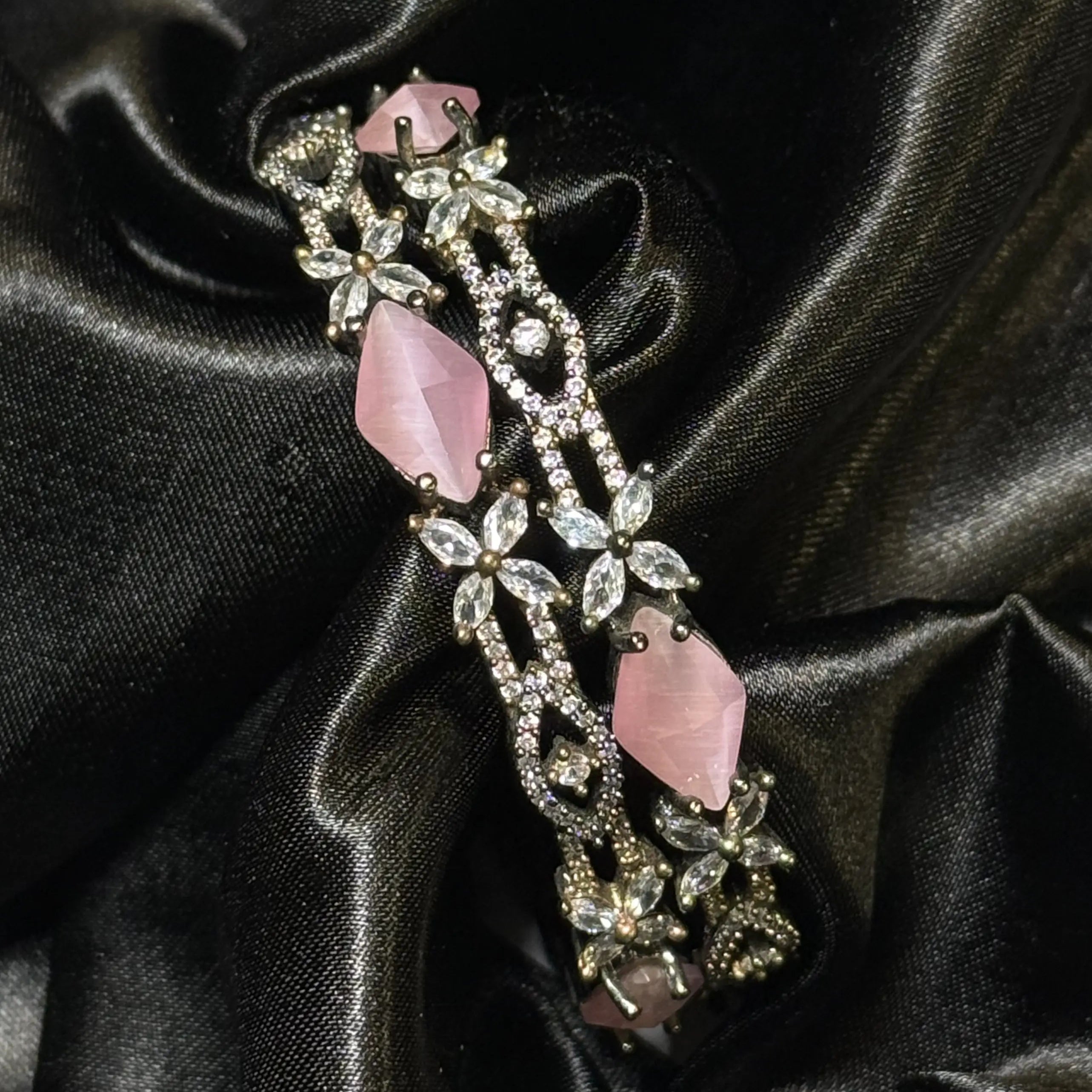 Pakistani silver-toned bangles with pink stones and floral diamonds