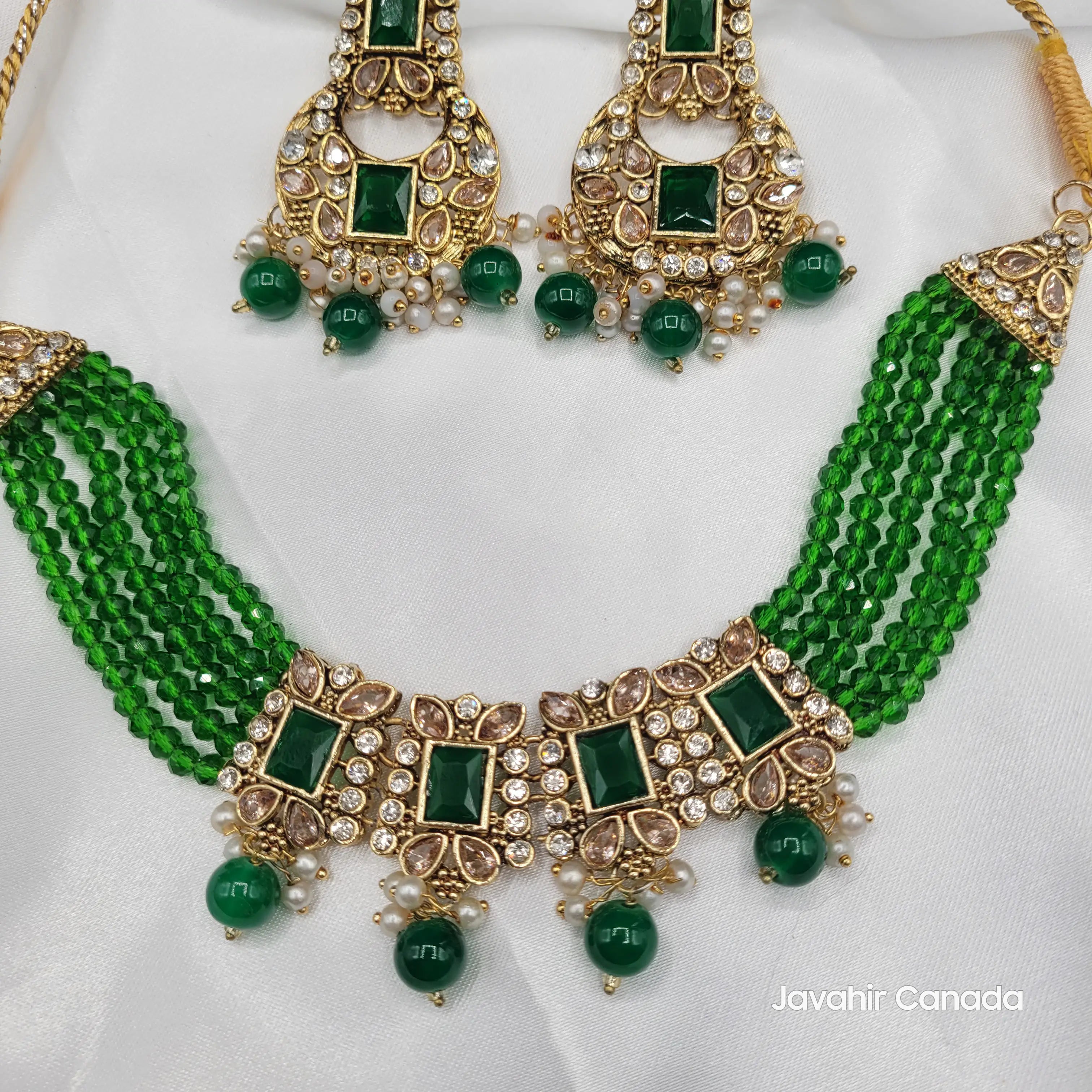close up of emerald green Firdous set with layered green beaded strands