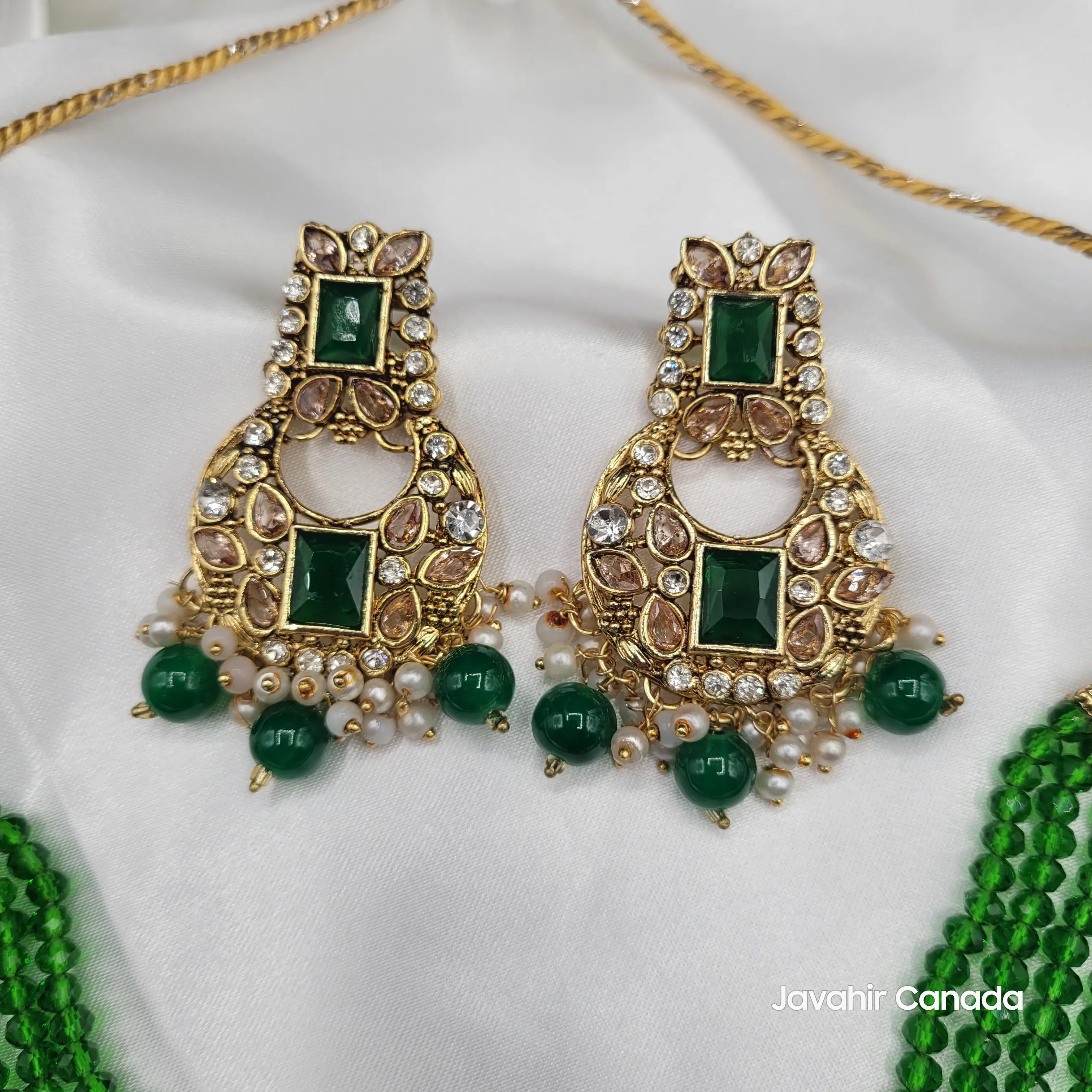 Full earring view from the Firdous emerald green set with gemstone beads on white background.
