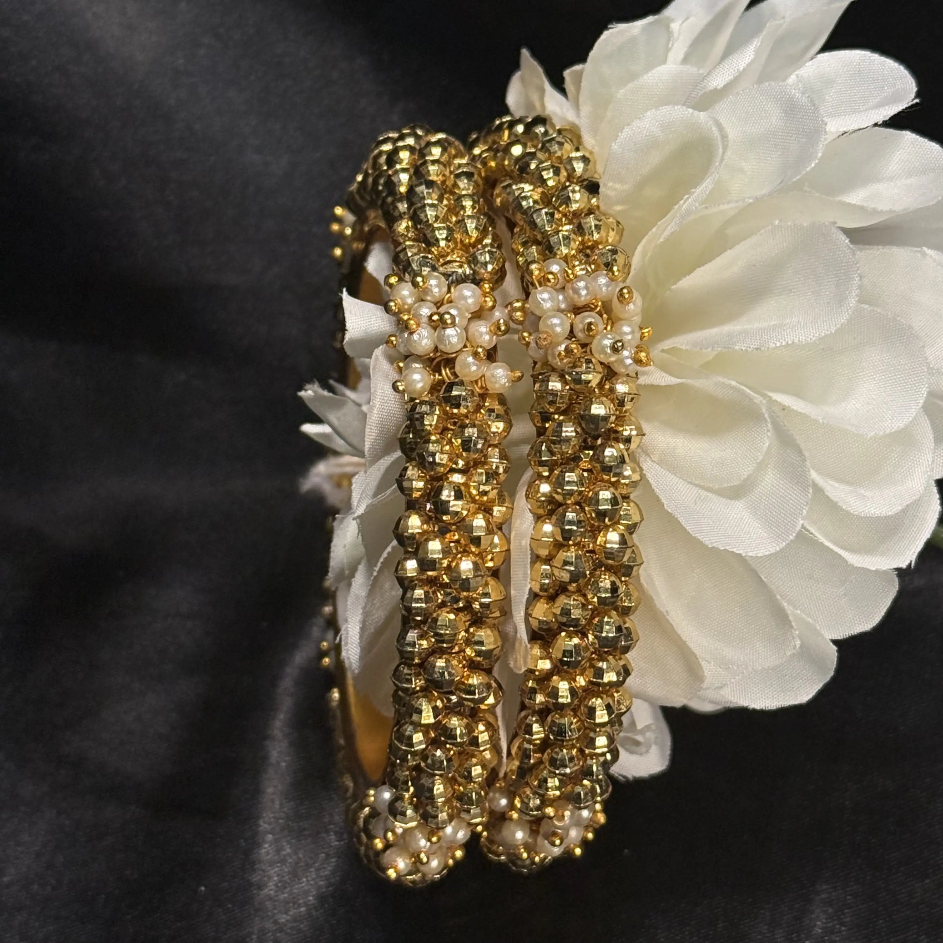 Traditional Indian bangle set with gold beads and white pearls