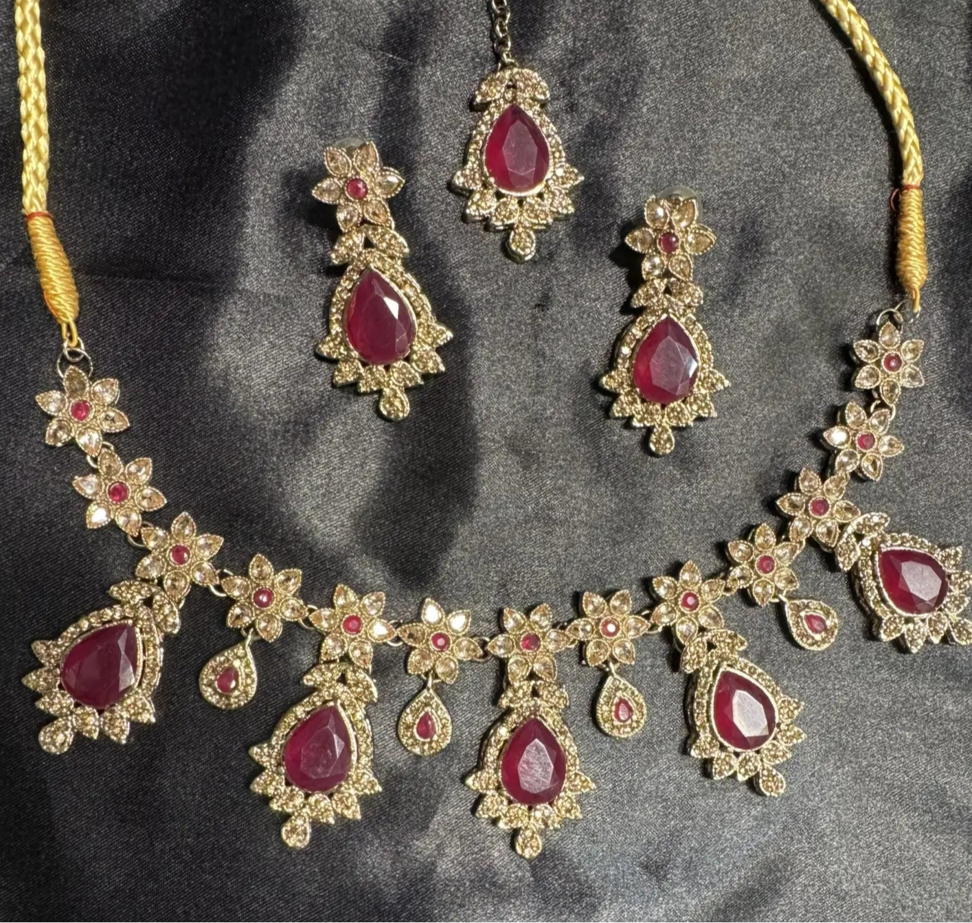 Handmade hot pink bridal necklace set with teardrop gemstones and floral CZ design, gold-plated finish, includes earrings and teeka
