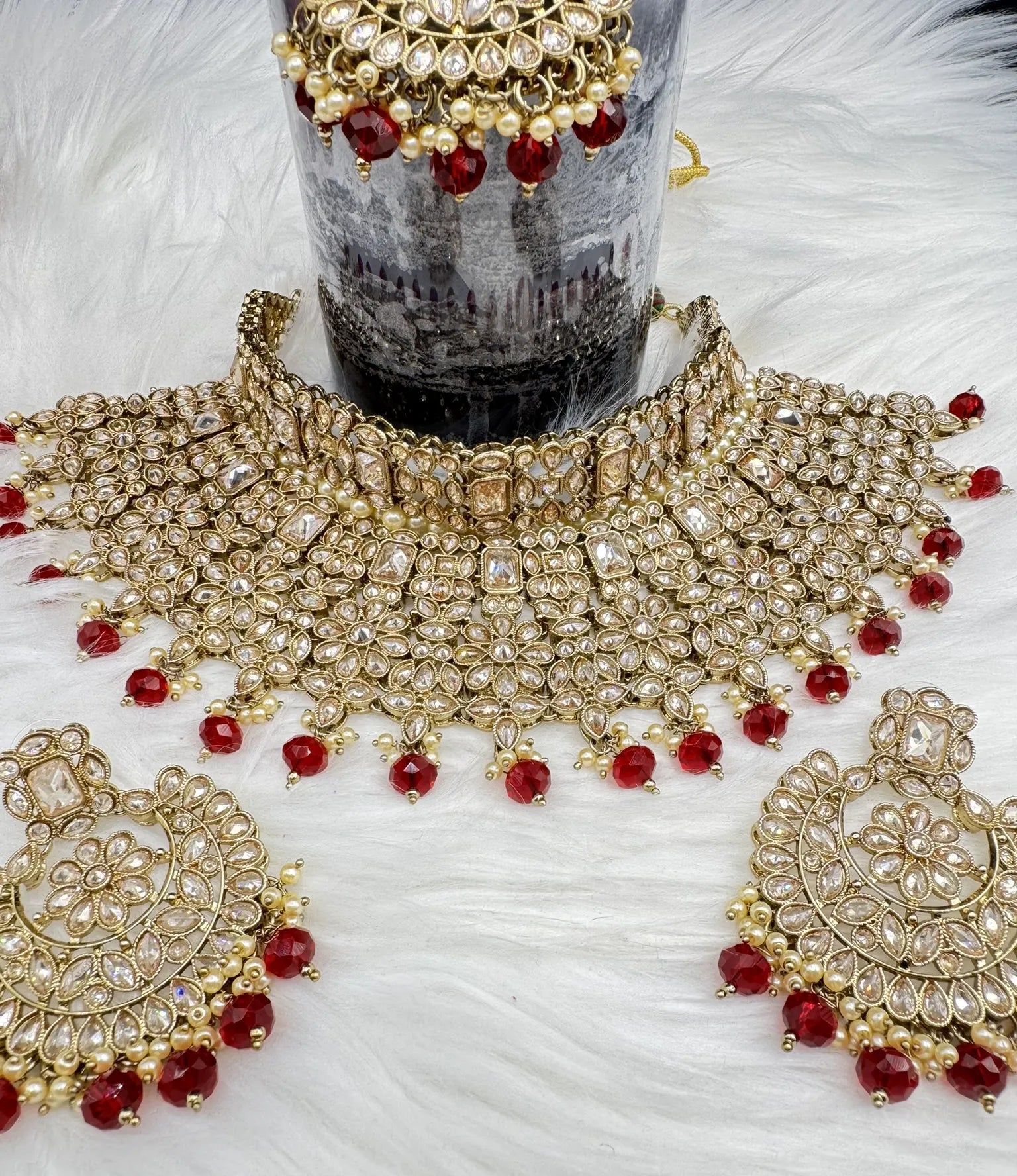 top view of Gold-plated Indian bridal set with elegant earrings & teeka. Intricate detailing, waterproof, anti-tarnish