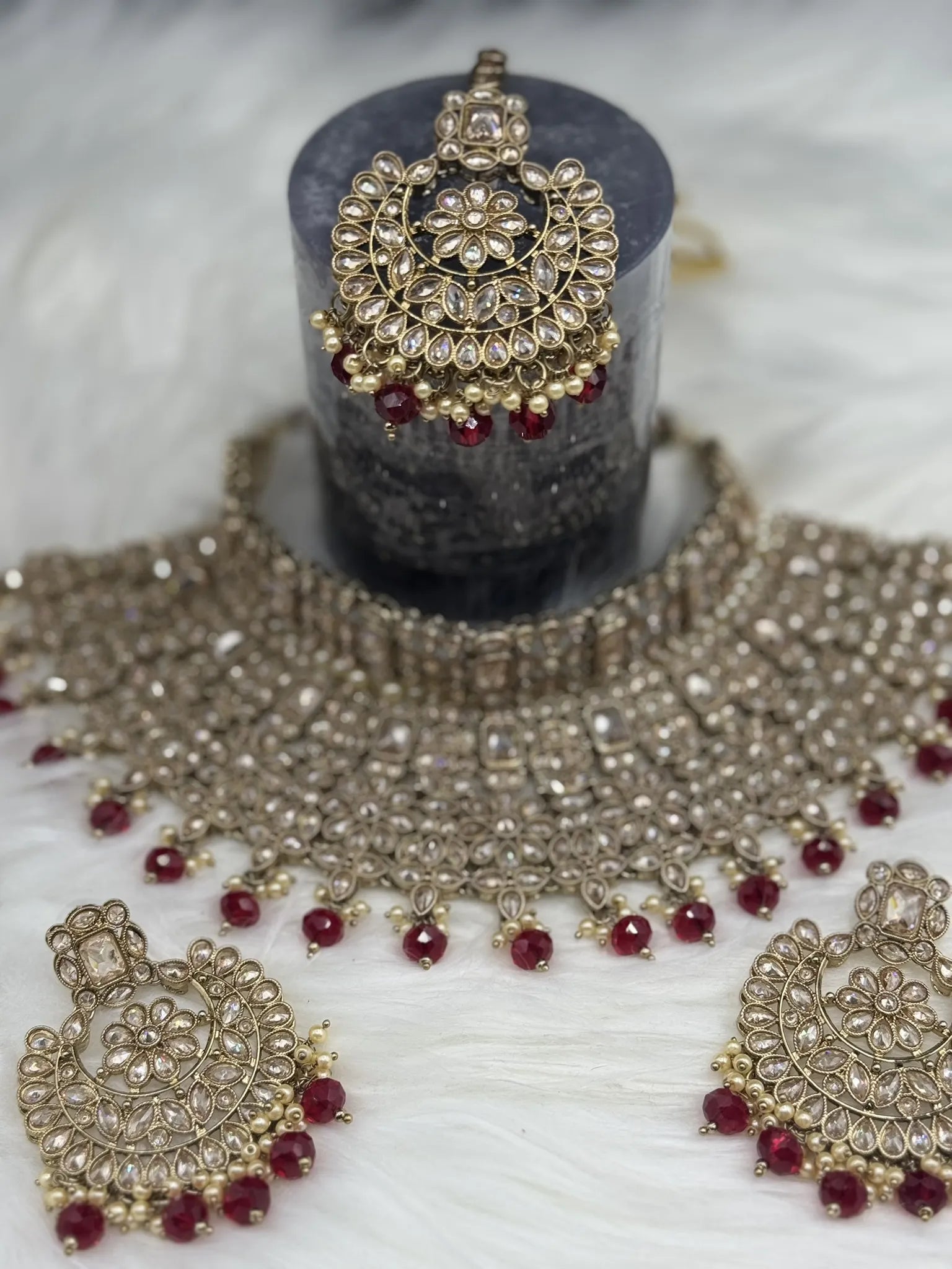 top view of Gold-plated Indian bridal set with elegant earrings & teeka. Intricate detailing, waterproof, anti-tarnish