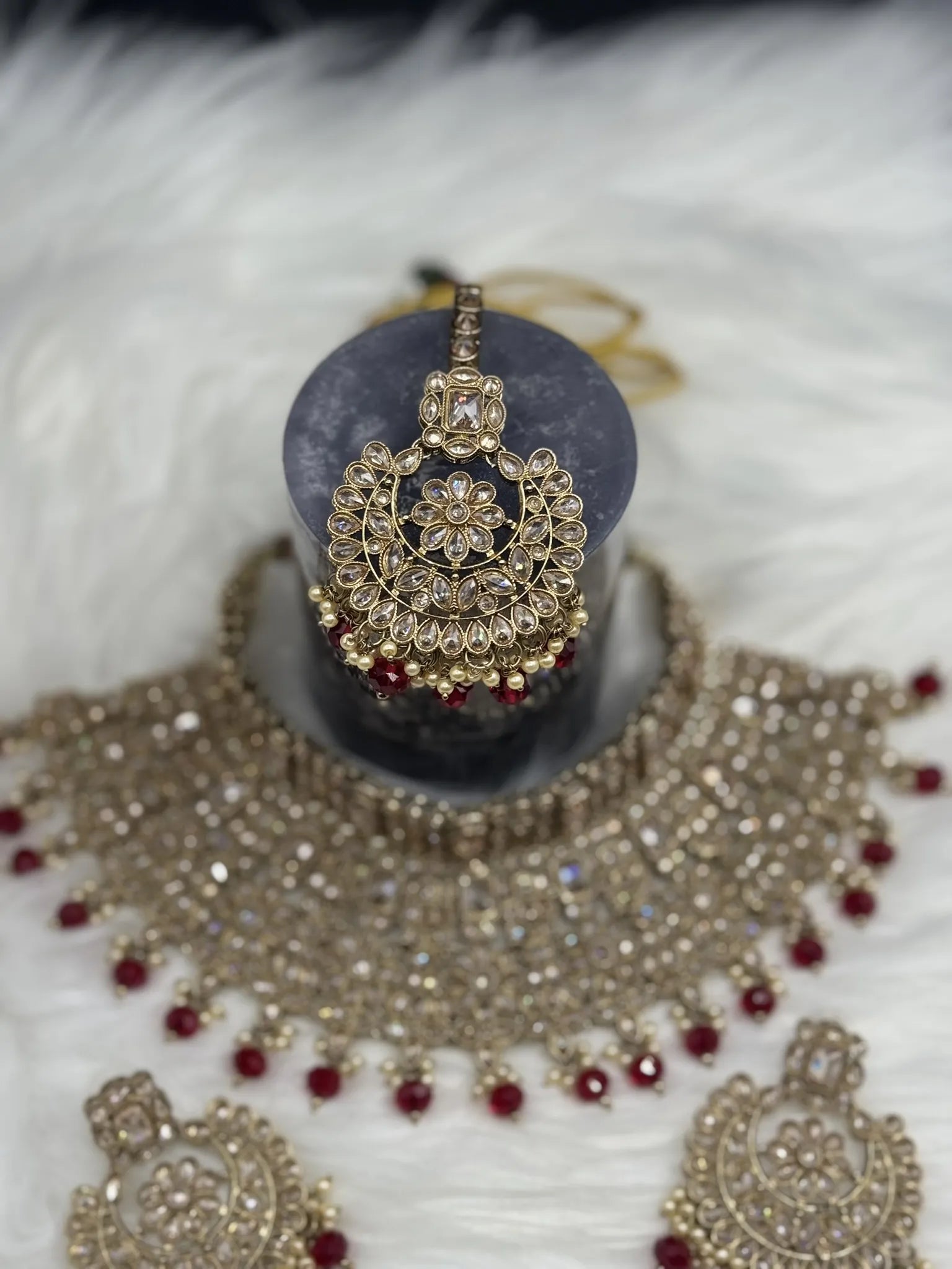 teeka focused gold-plated Indian bridal set with elegant earrings & teeka. Intricate detailing, waterproof, anti-tarnish