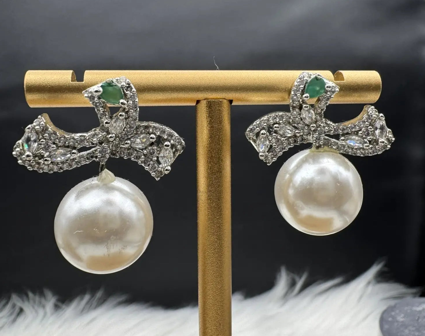 Pair of Pearl drop American diamonds earrings with teal colored stone