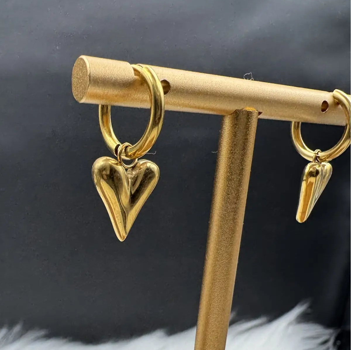 another angle of gold plated and stainless steel small heart shaped hoop earrings