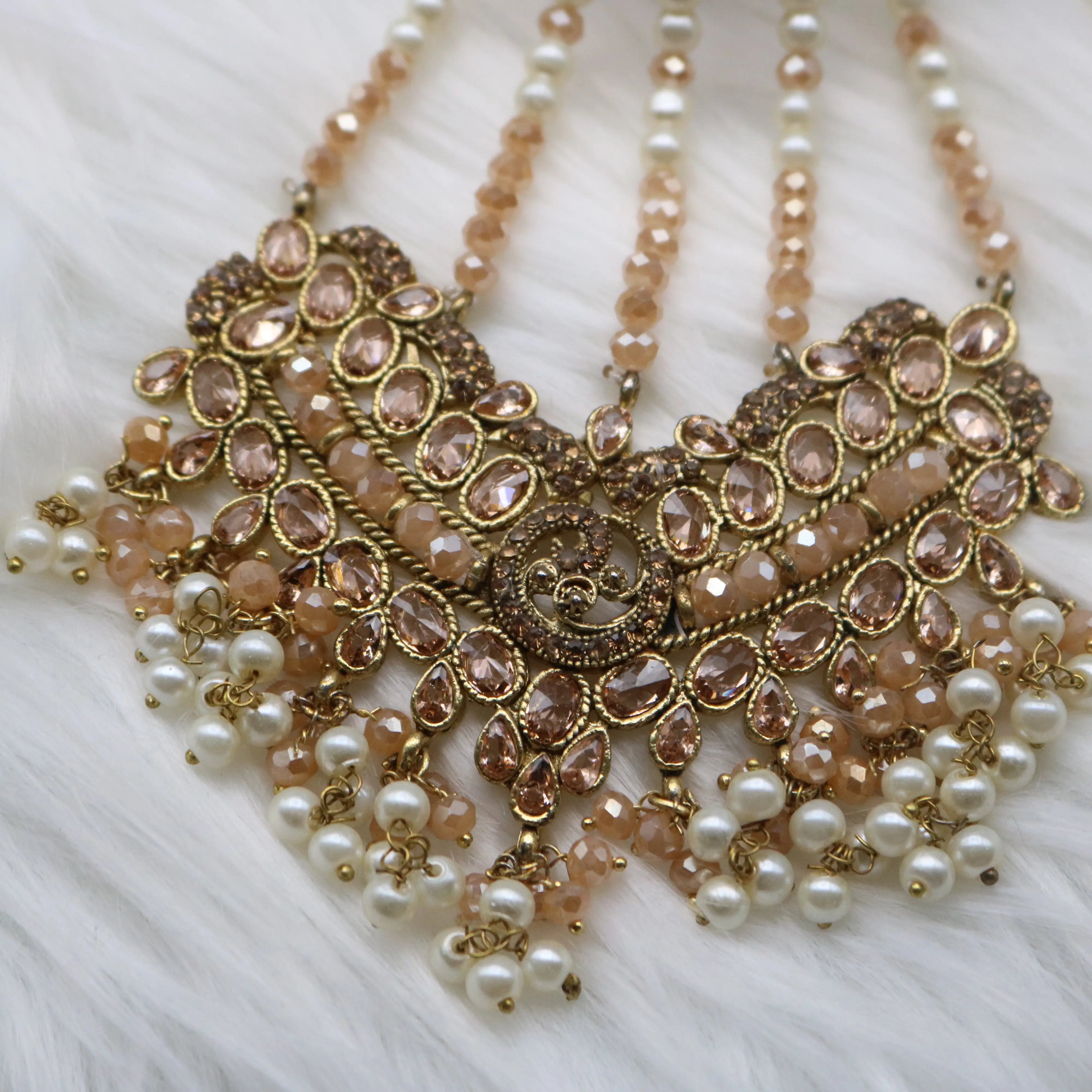 jhoomer view of Gold and champagne Pakistani bridal necklace jewelry set with jhoomer