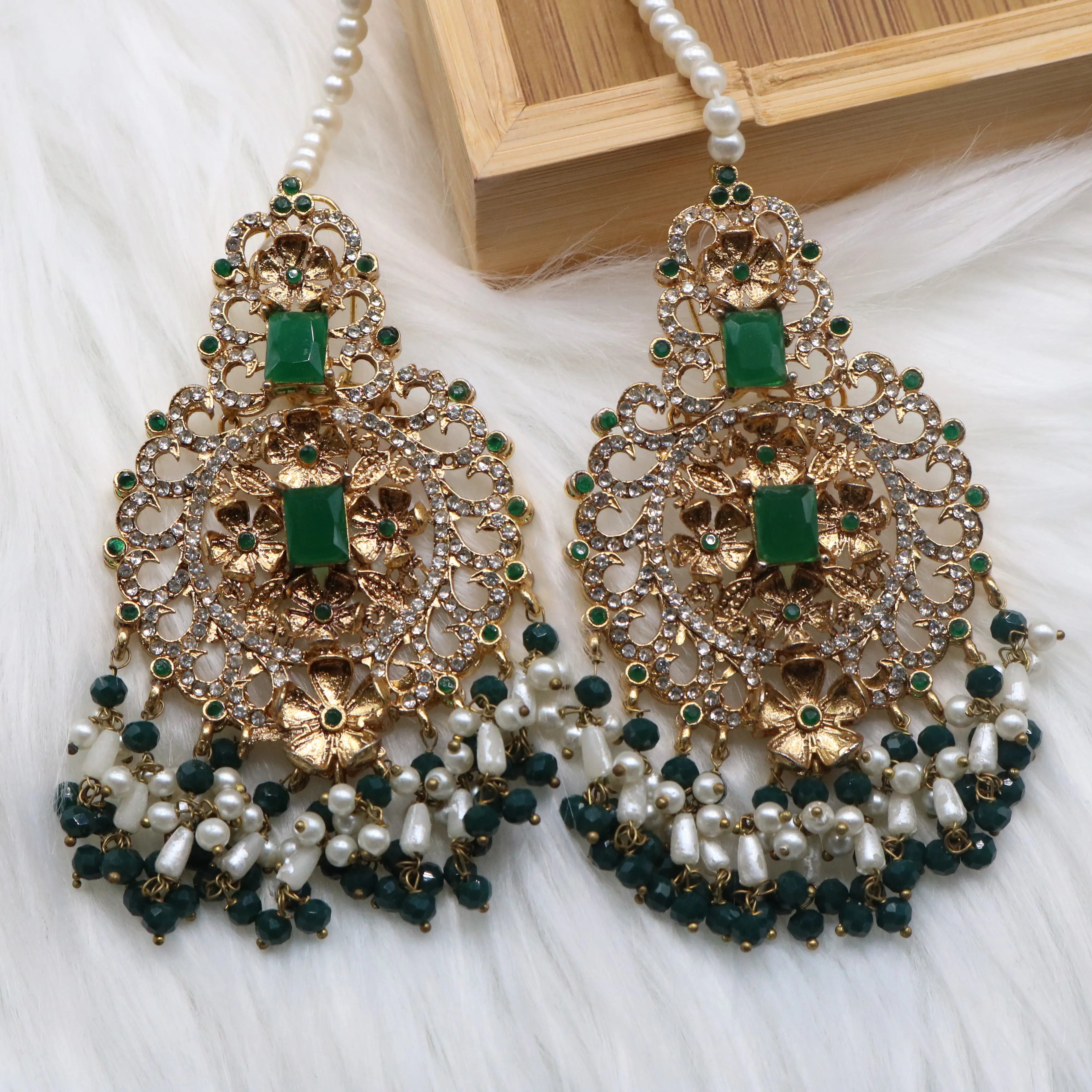 earrings view of Pakistani bridal necklace set with earrings, jhoomer and teeka in green and gold with pearls