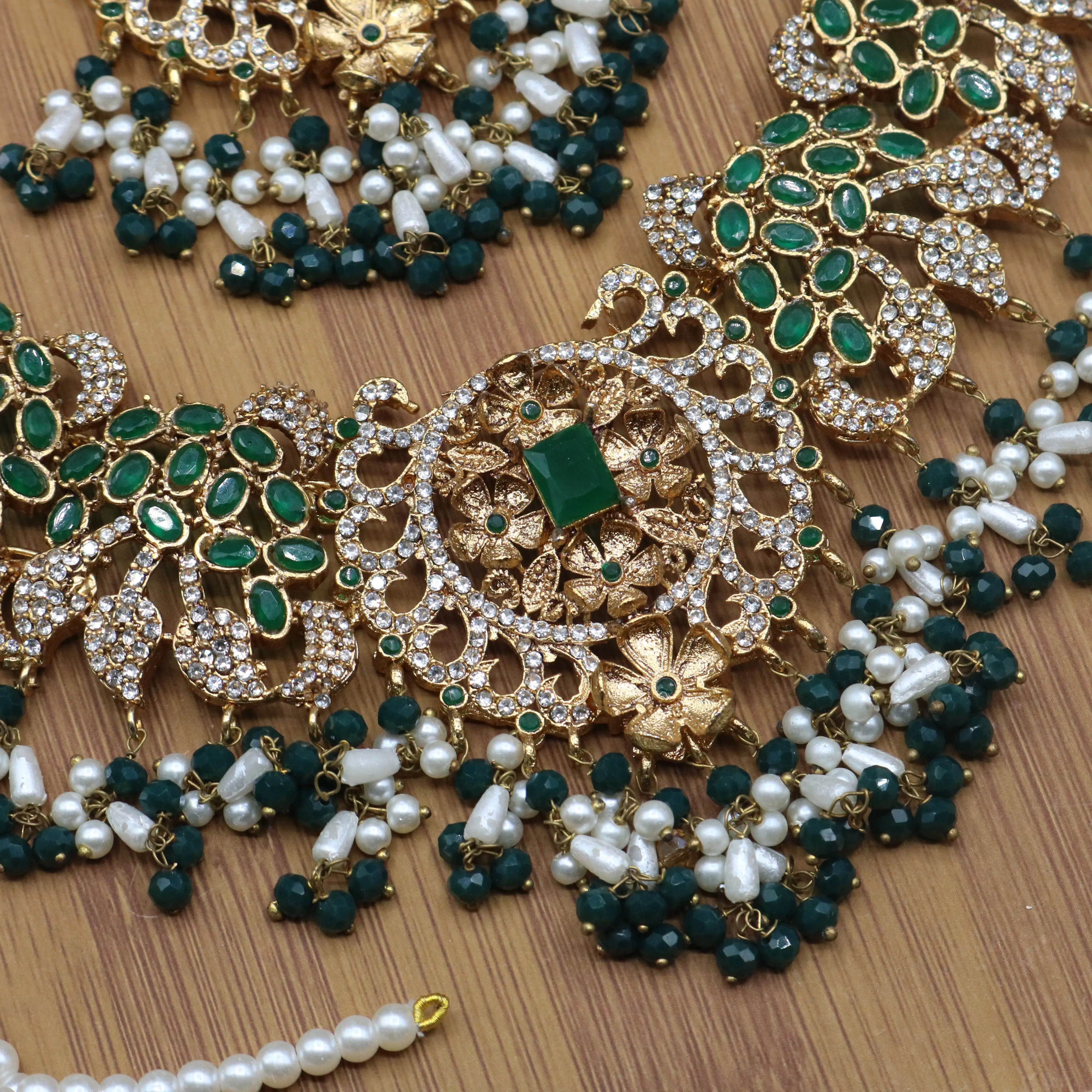 necklace view of Pakistani bridal necklace set with earrings, jhoomer and teeka in green and gold with pearls