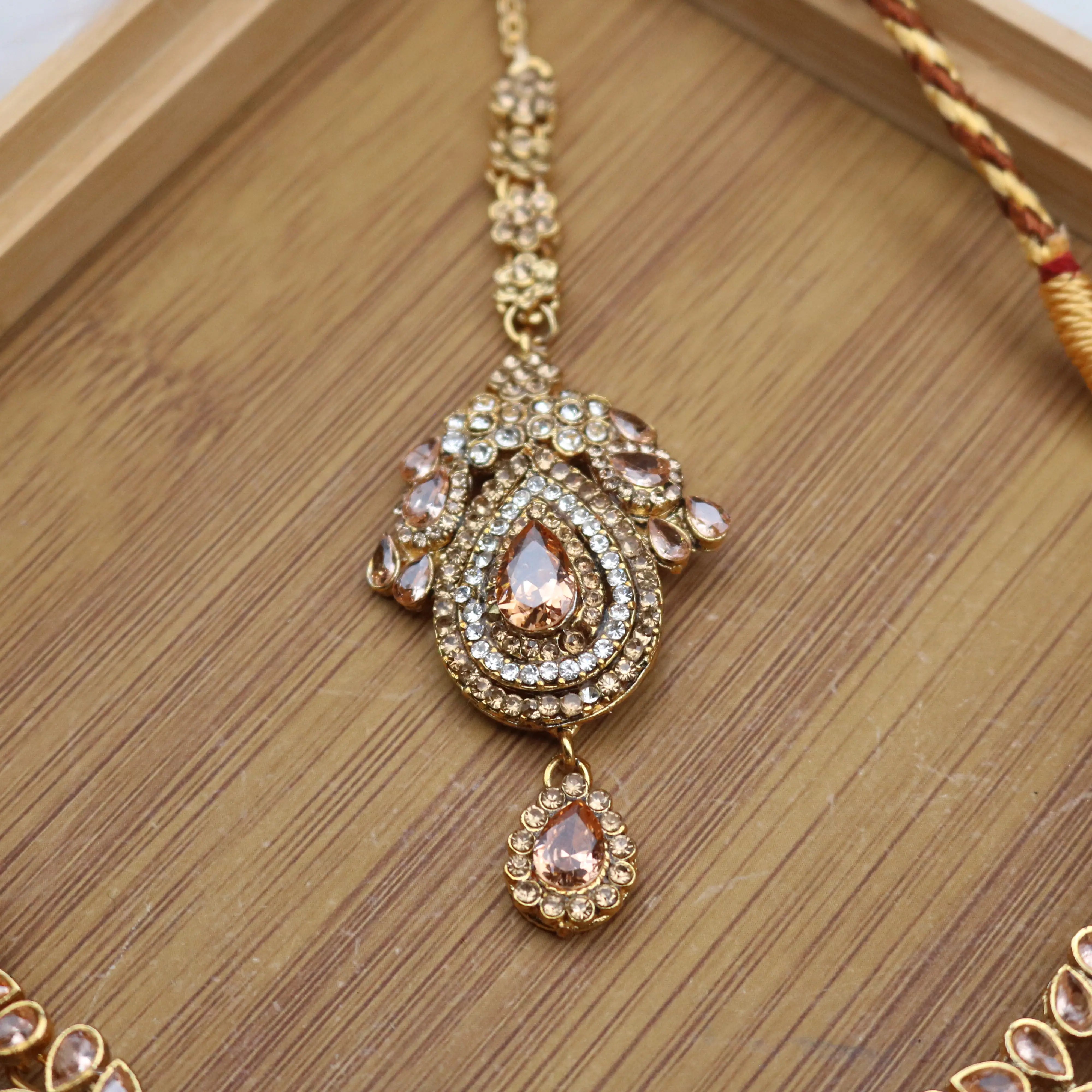 teeka view of Champagne teardrop bridal necklace set with earrings, teeka & jhoomer in stainless steel