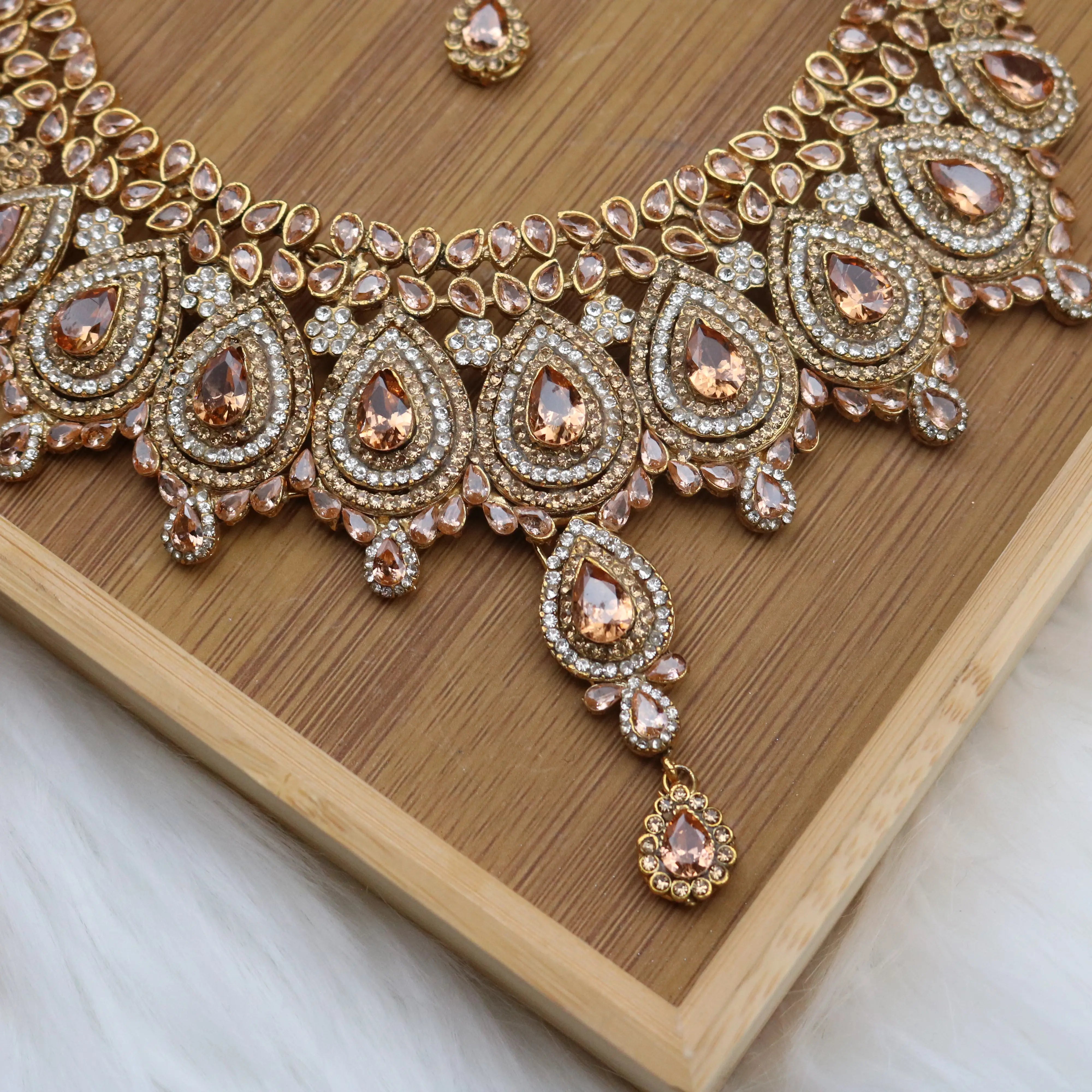 closer necklace view of Champagne teardrop bridal necklace set with earrings, teeka & jhoomer in stainless steel