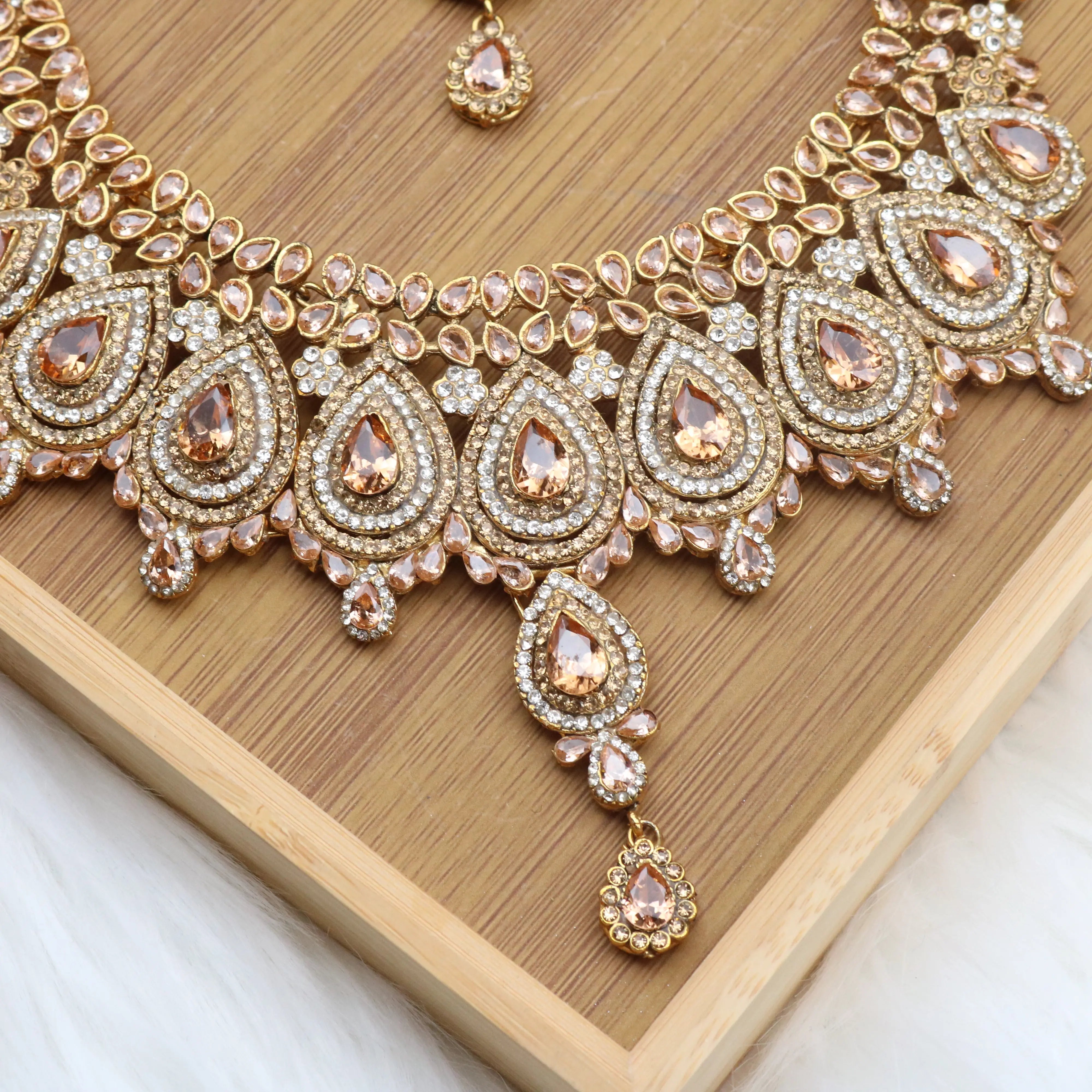 necklace view of Champagne teardrop bridal necklace set with earrings, teeka & jhoomer in stainless steel