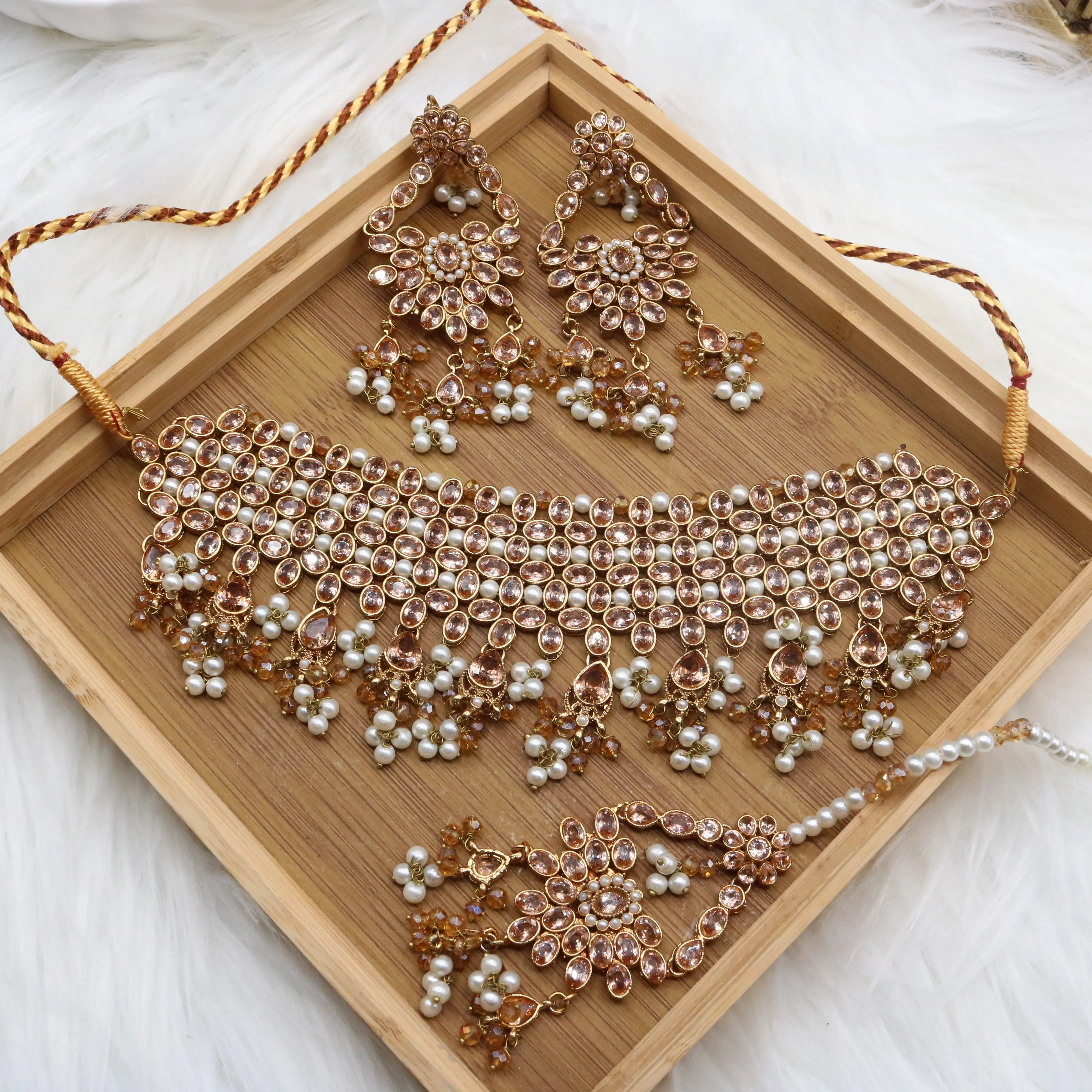 another angle of Champagne bridal choker necklace set with earrings and teeka in stainless steel