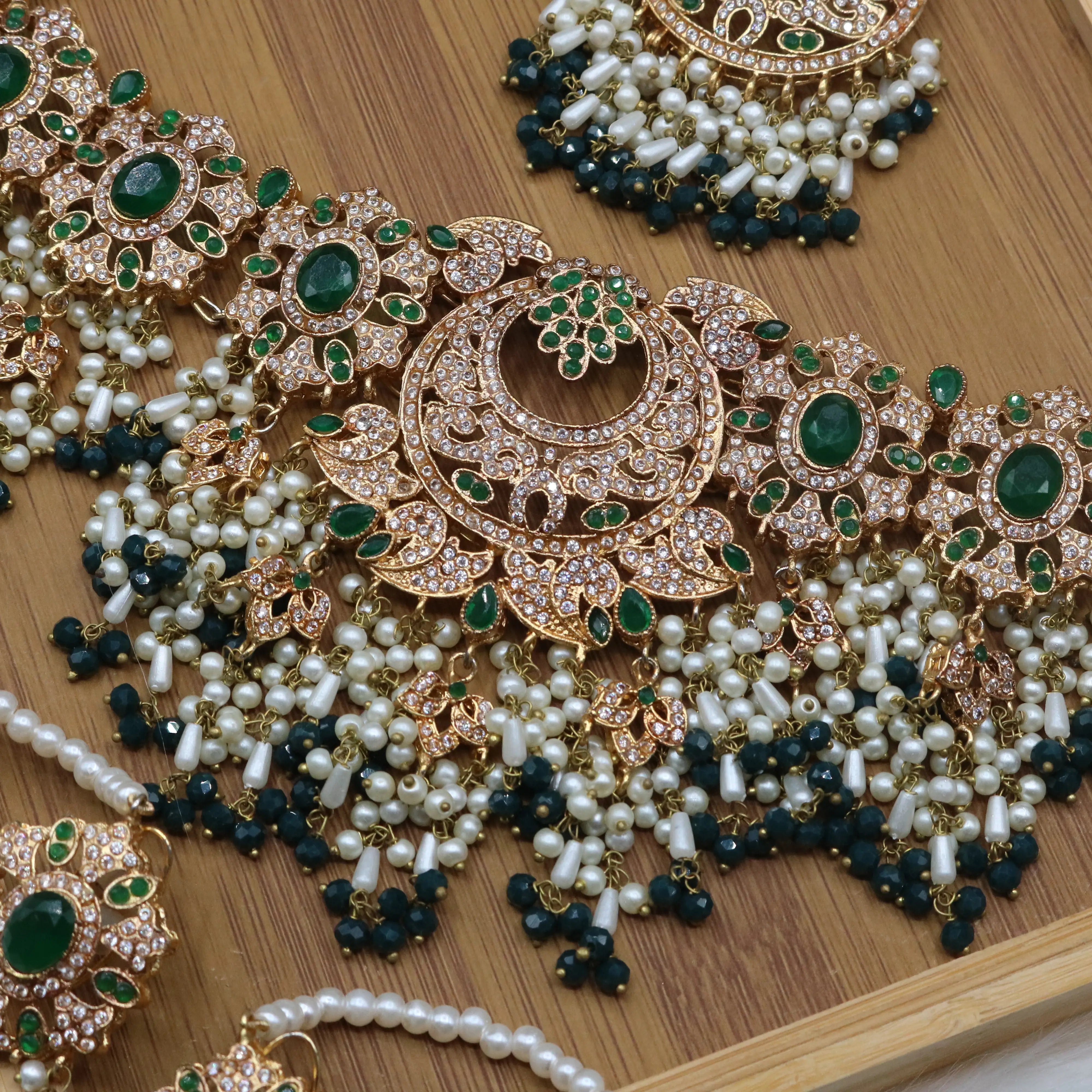 another necklace view of Emerald green bridal choker necklace with earrings and teeka in gold and pearls