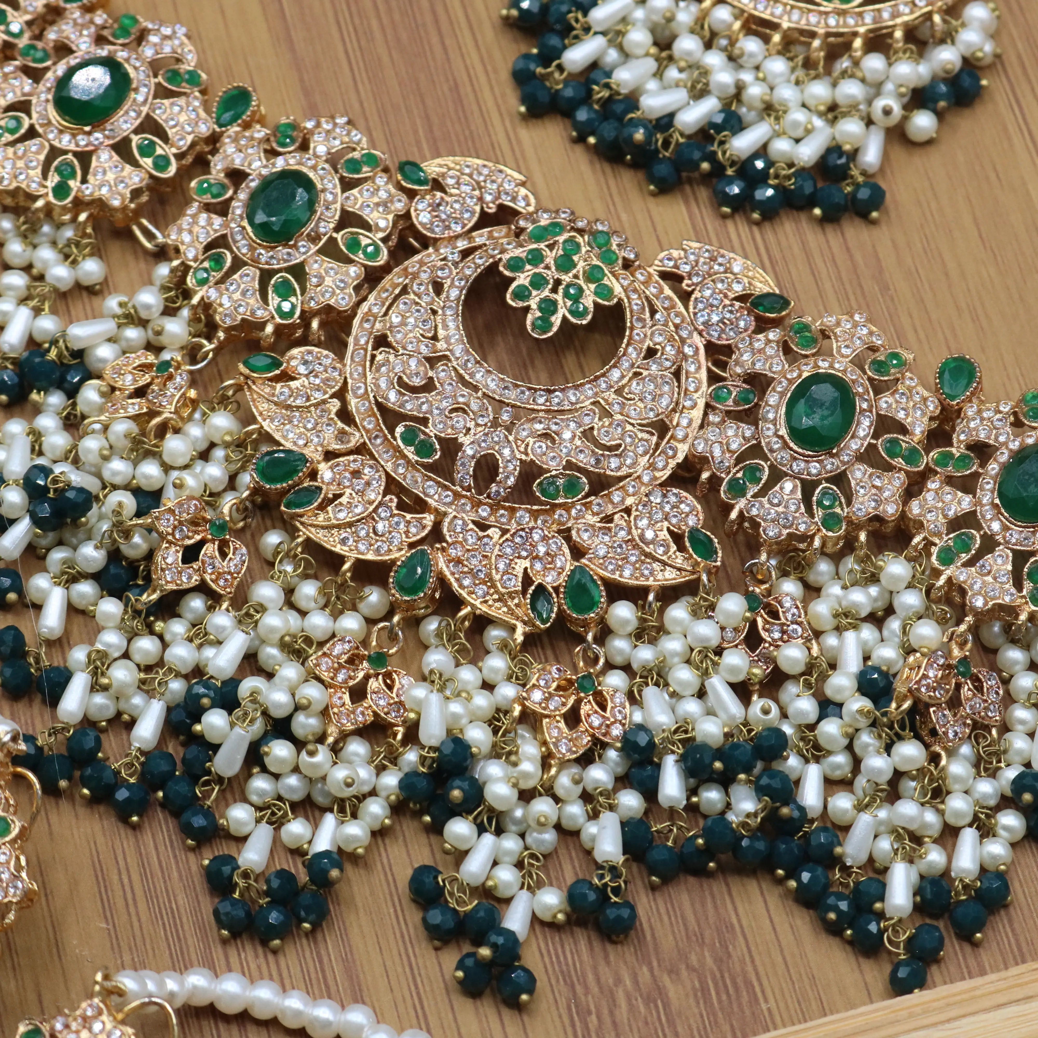 necklace view of Emerald green bridal choker necklace with earrings and teeka in gold and pearls