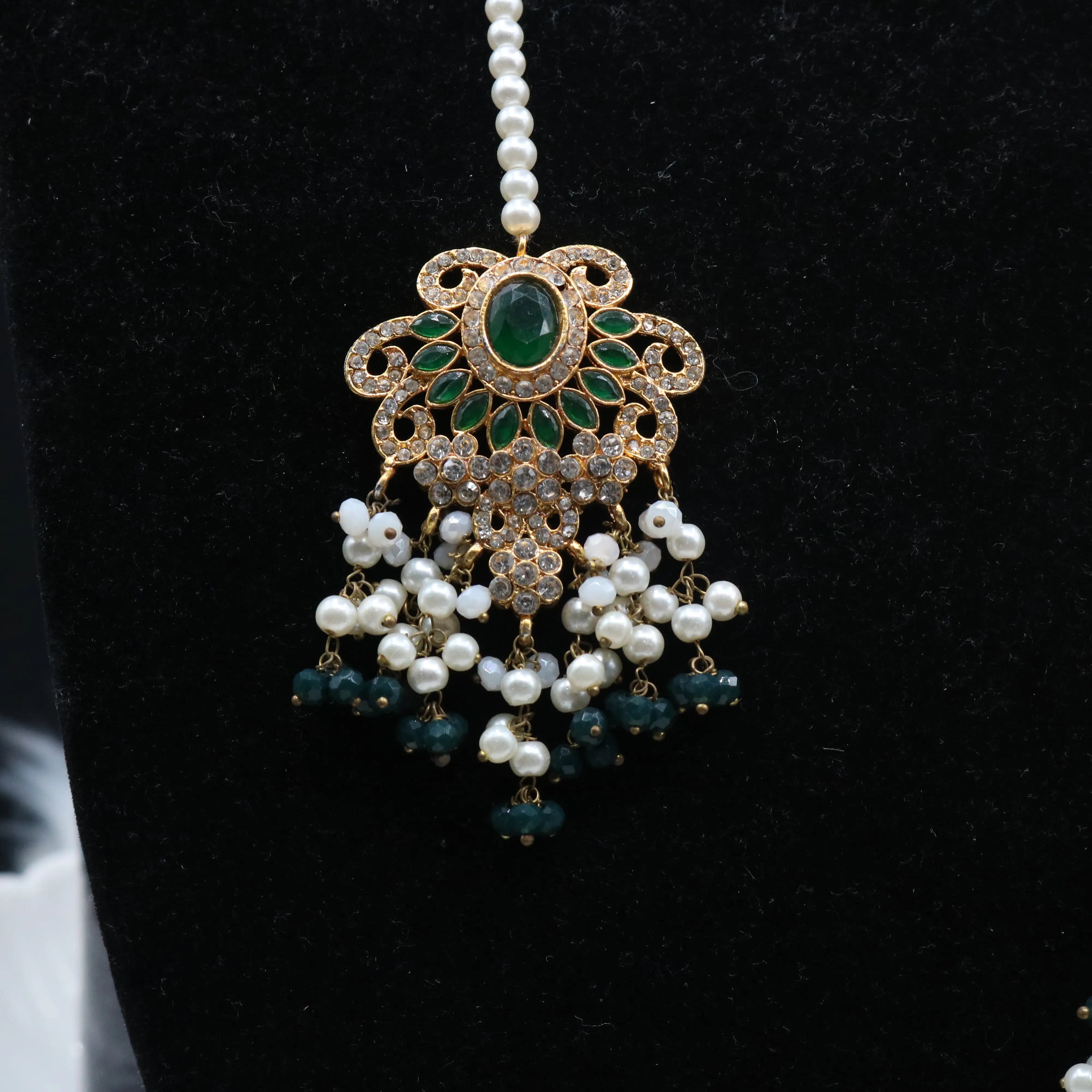 teeka view of Royal emerald bridal choker necklace with teardrop stones and pearls