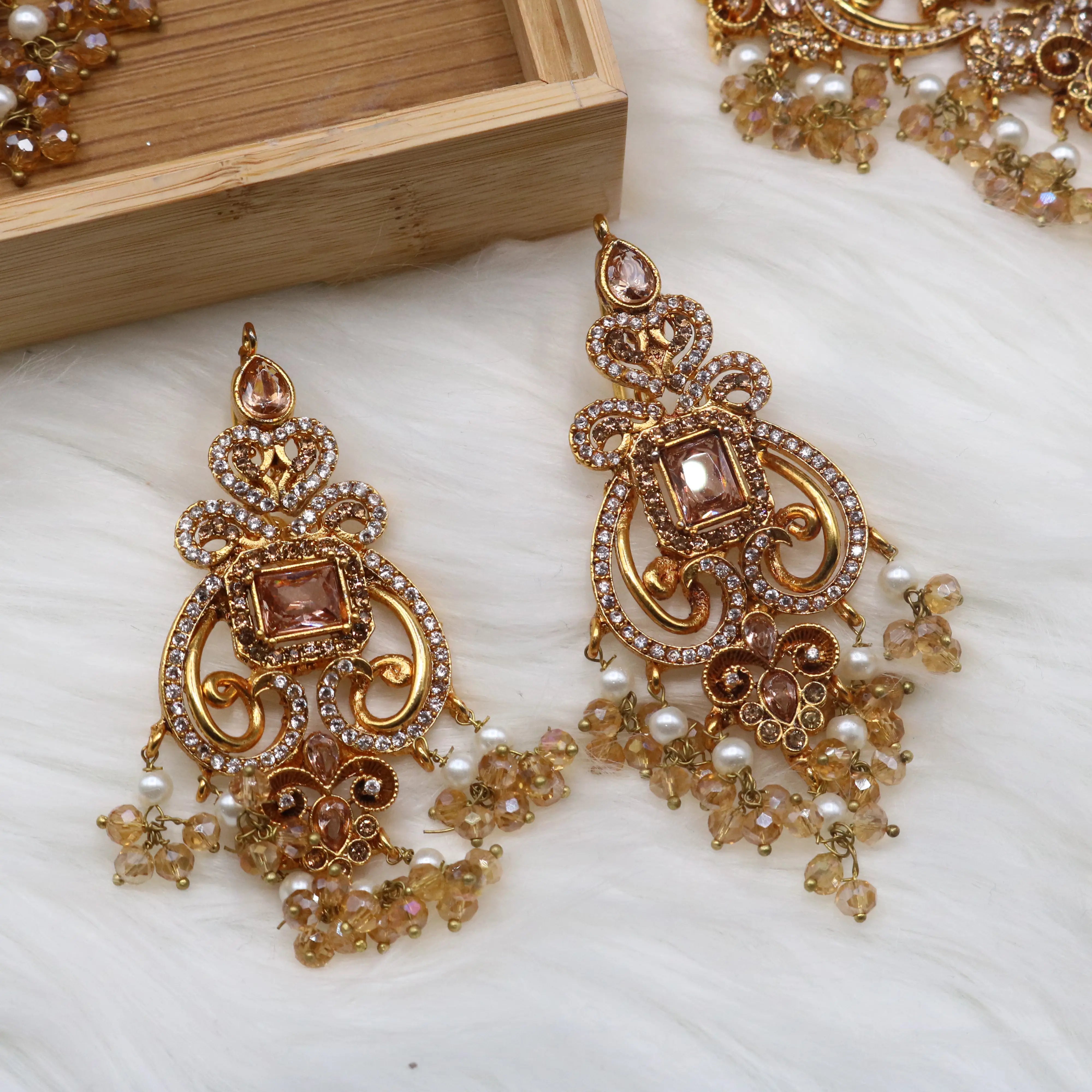 earrings view of Champagne gold bridal necklace set with earrings, teeka & jhoomer in stainless steel