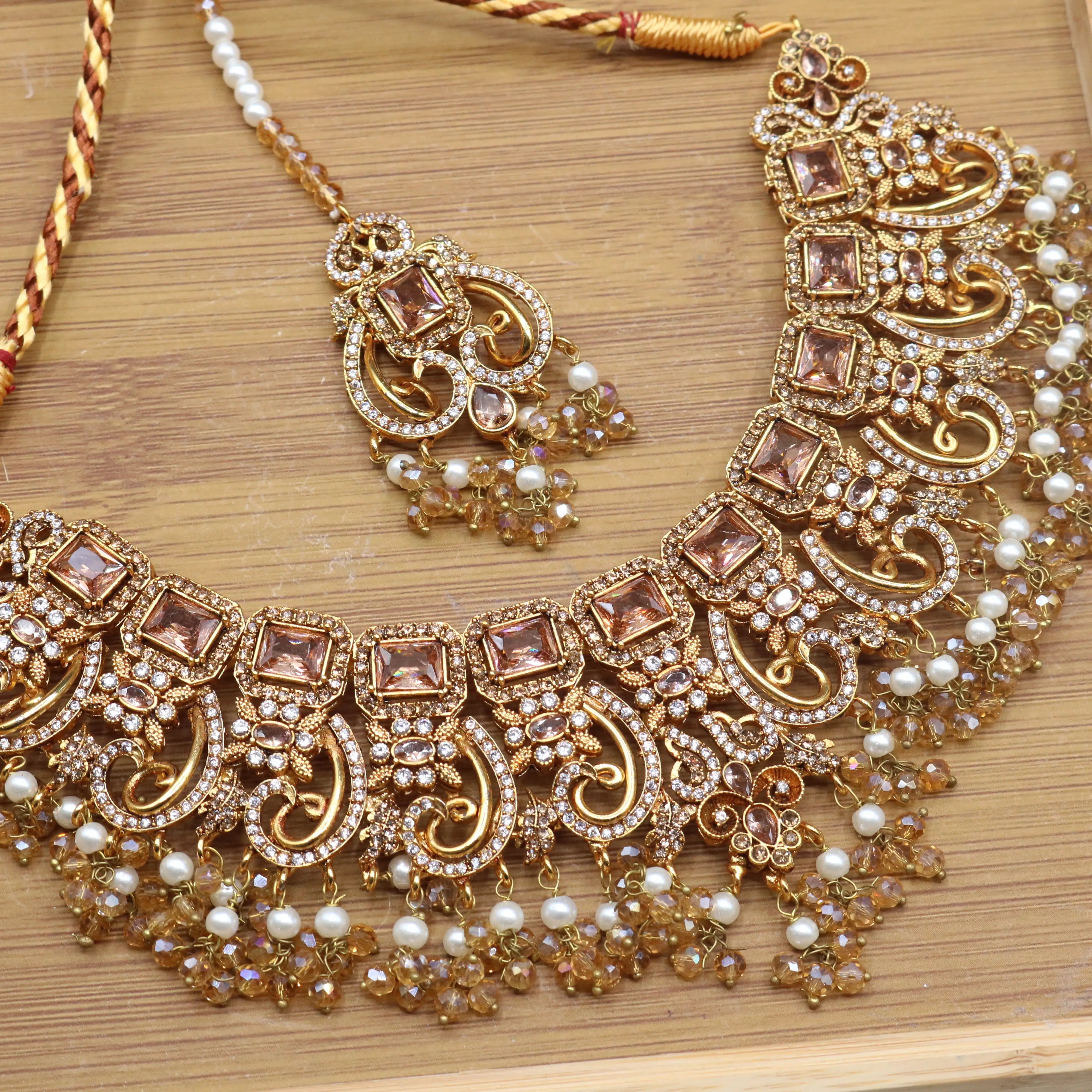 necklace closer view of Champagne gold bridal necklace set with earrings, teeka & jhoomer in stainless steel