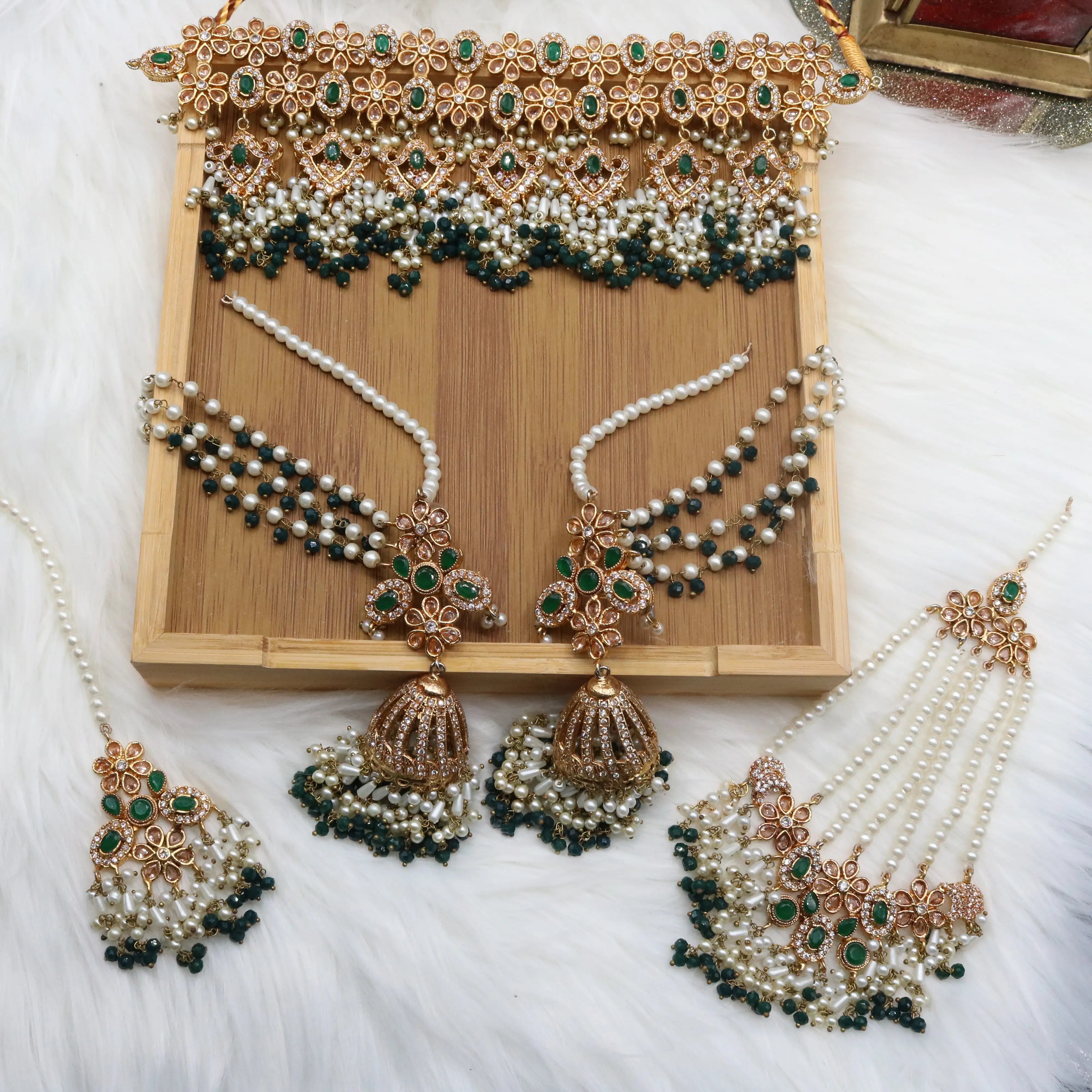 Emerald bridal choker necklace with jhumka sahara earrings, teeka & jhoomer