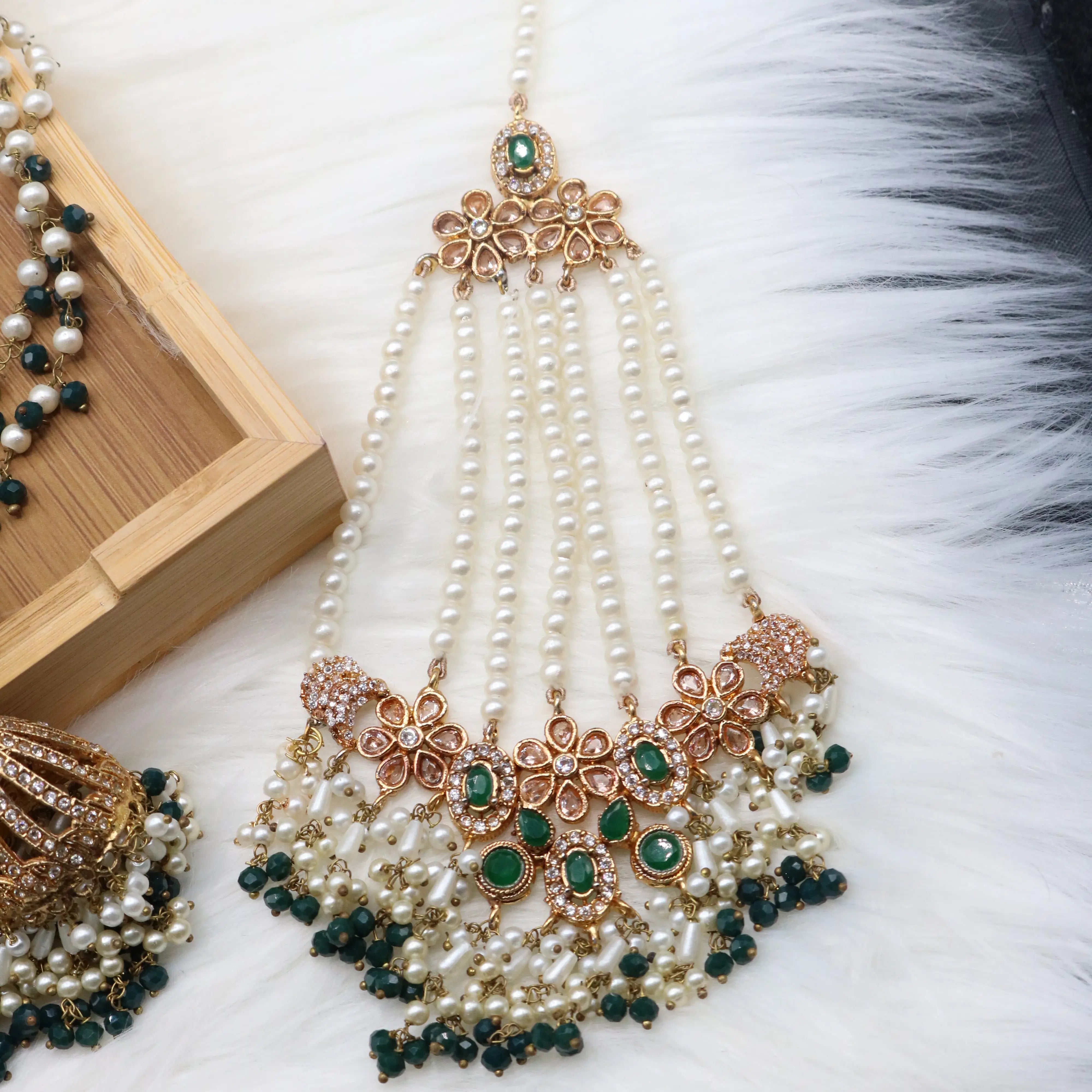 jhoomer view of Emerald bridal choker necklace with jhumka sahara earrings, teeka & jhoomer