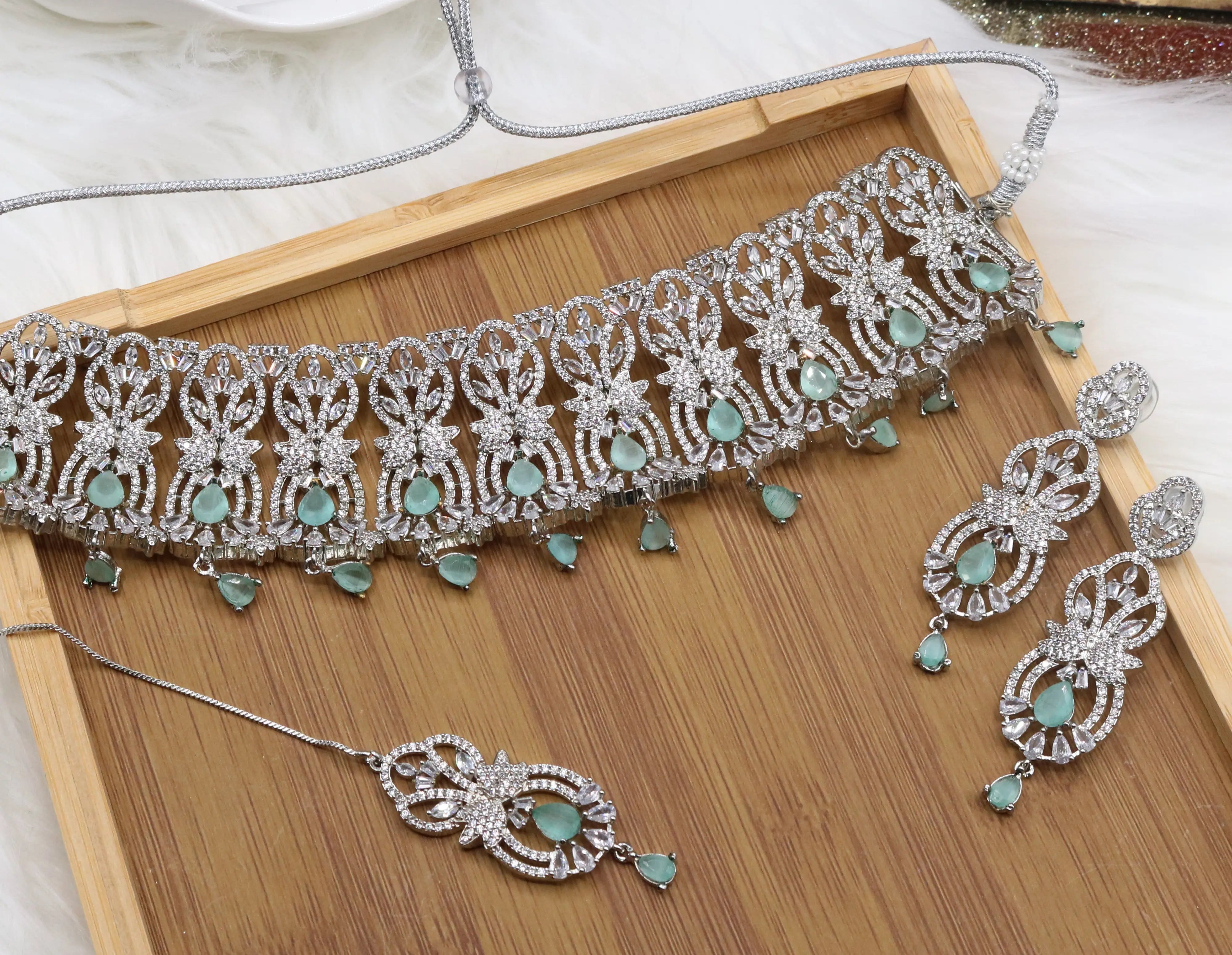 Silver finish partywear jewelry set with American diamonds