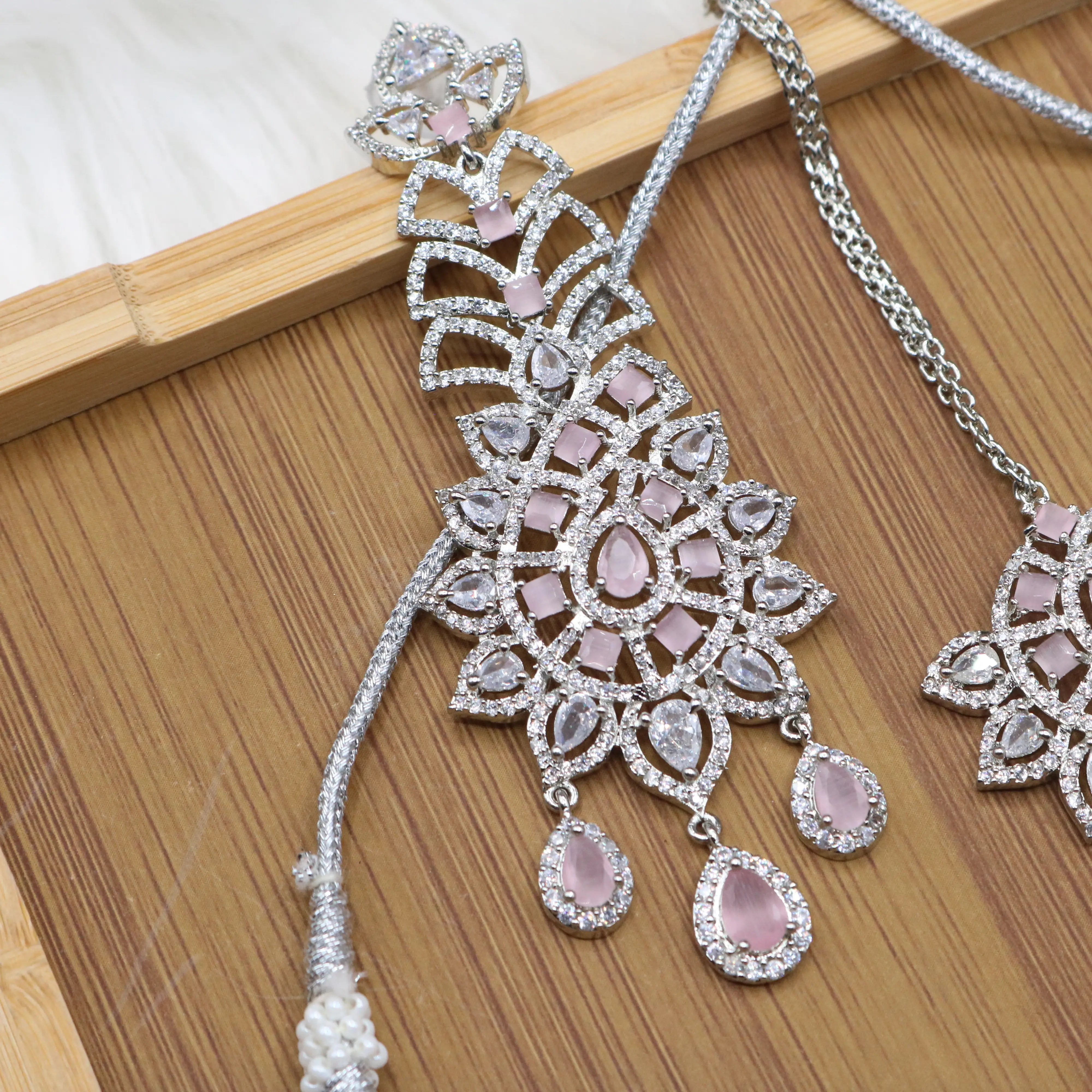 earring view of Silver and pink bridal choker necklace set with earrings and teeka