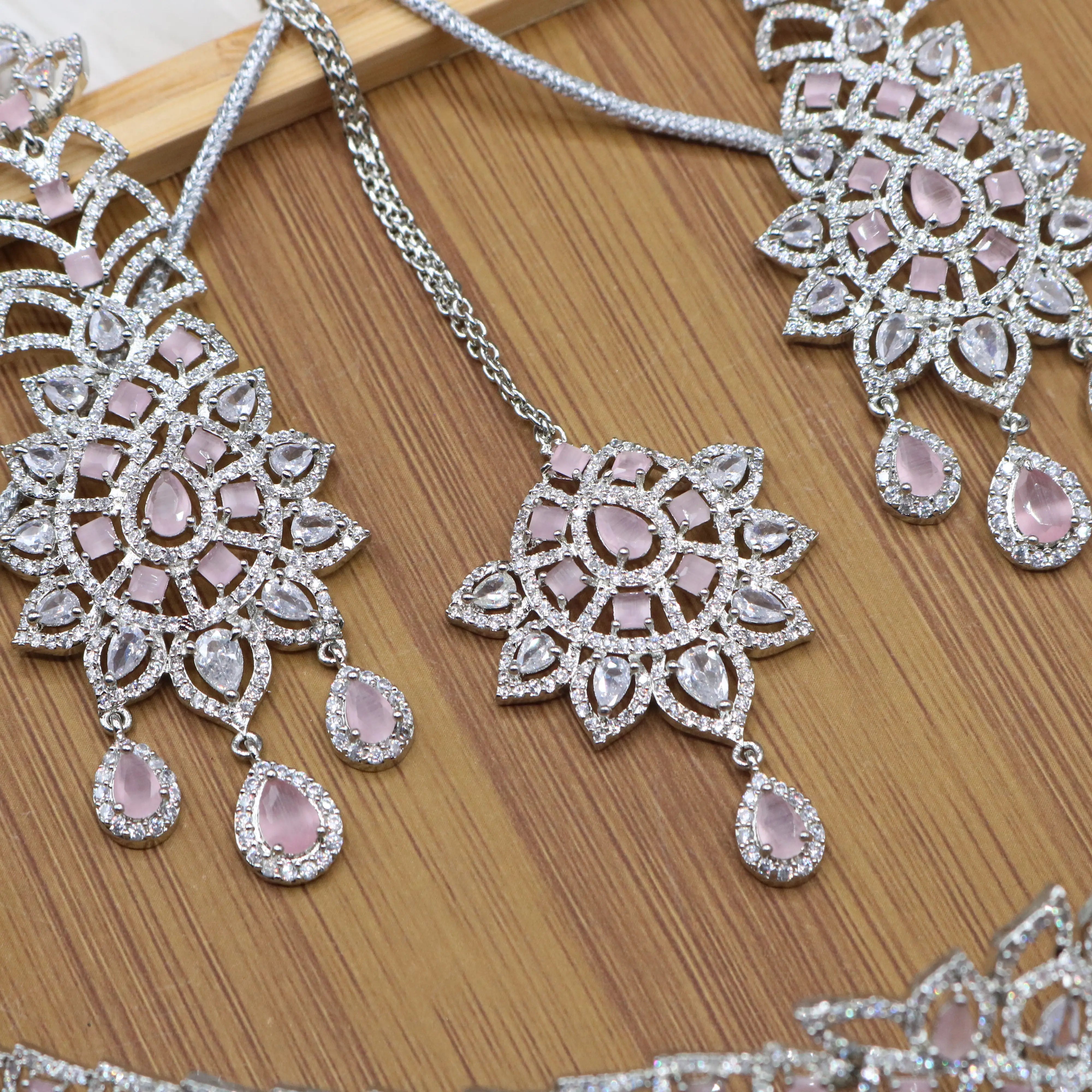 teeka view of Silver and pink bridal choker necklace set with earrings and teeka