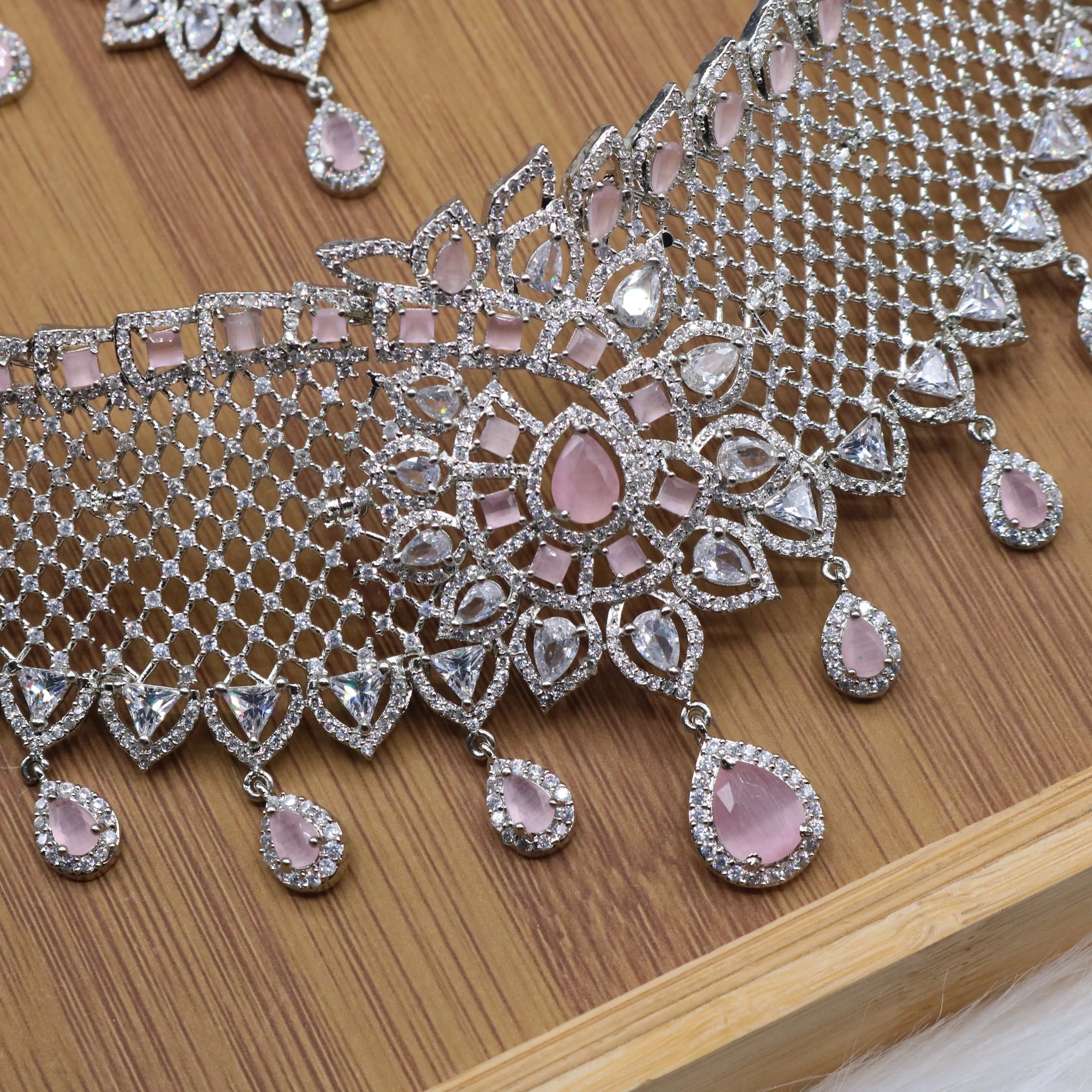 closer necklace view of Silver and pink bridal choker necklace set with earrings and teeka