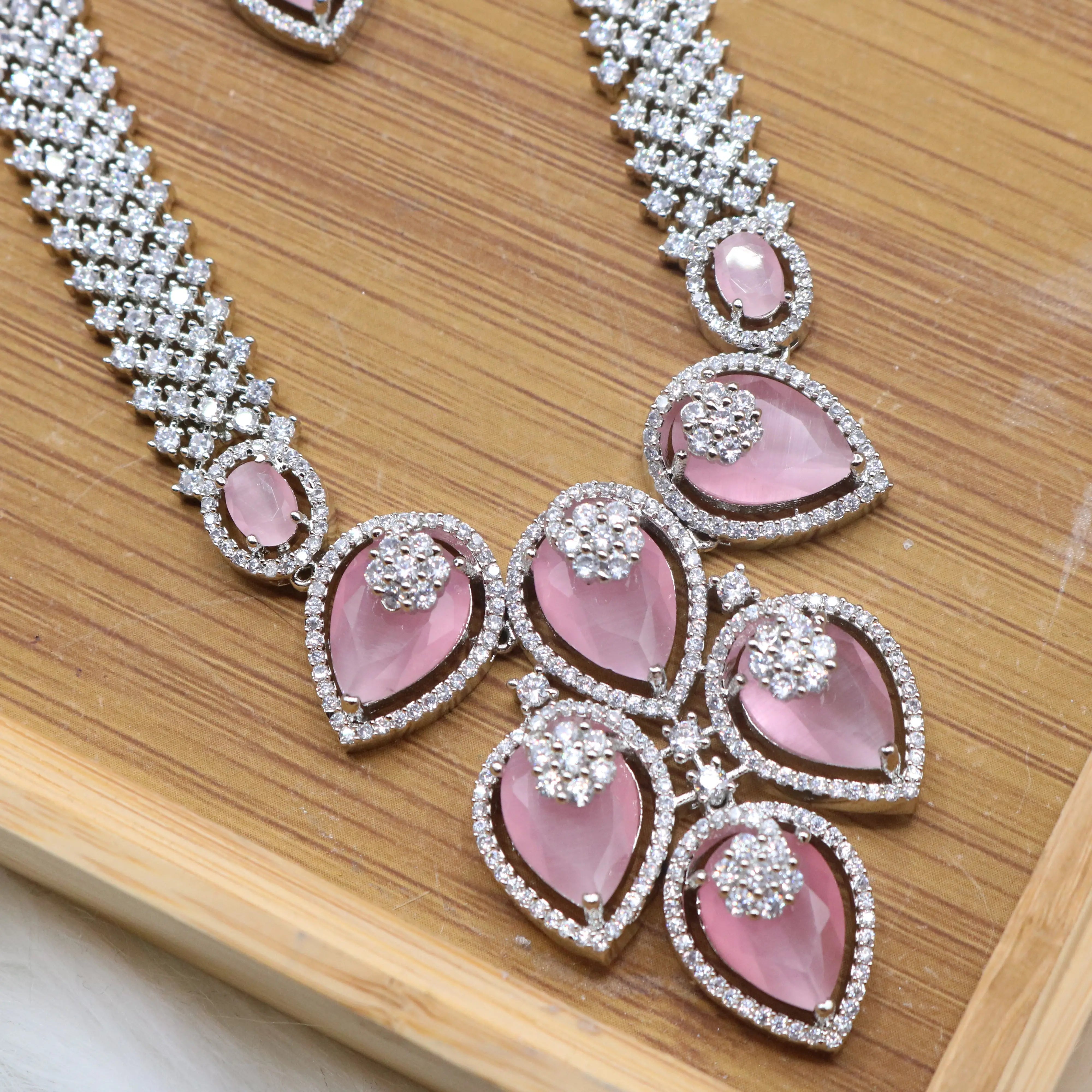 necklae pendant view of Silver and pink long bridal necklace set with earrings and teeka