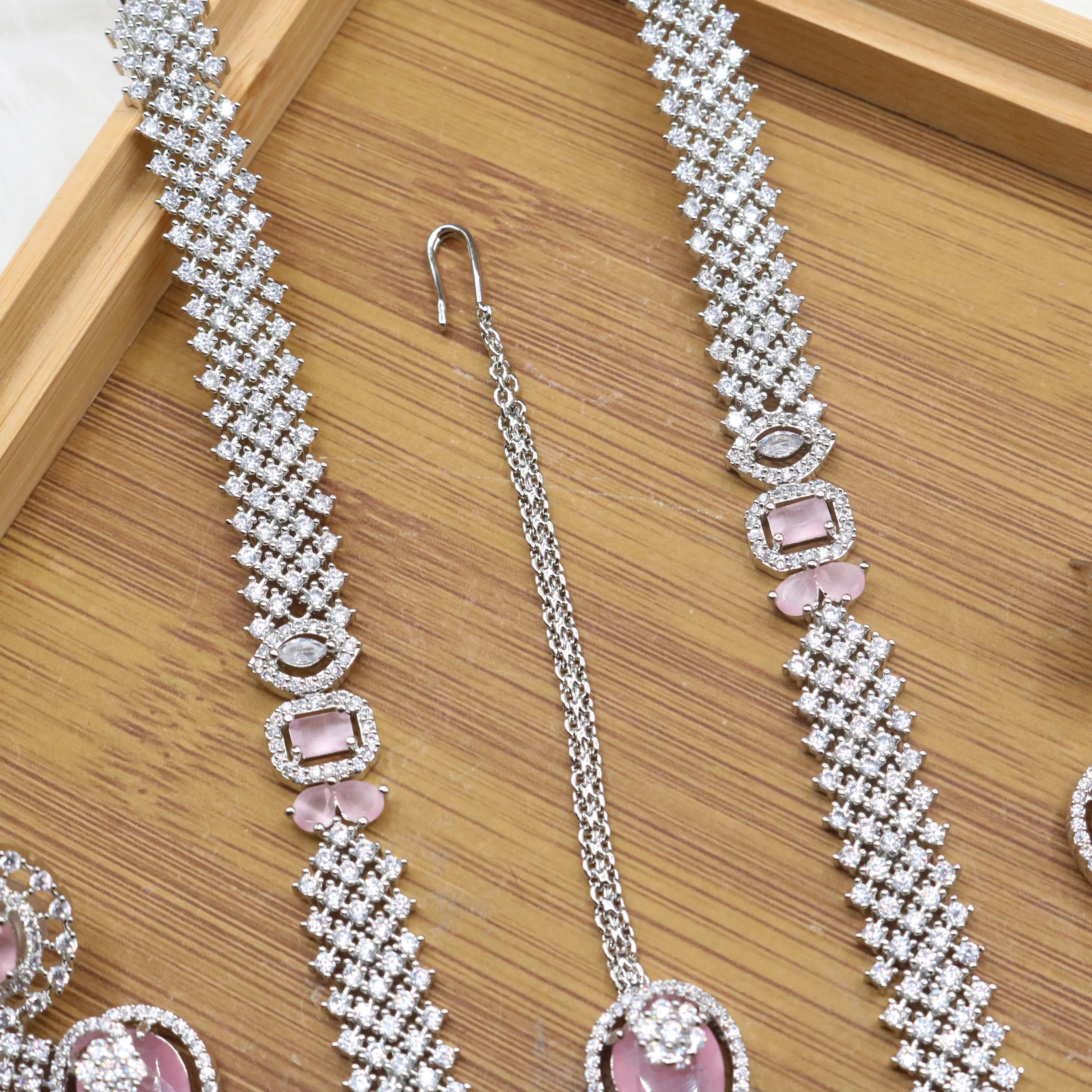 necklace chain view of Silver and pink long bridal necklace set with earrings and teeka